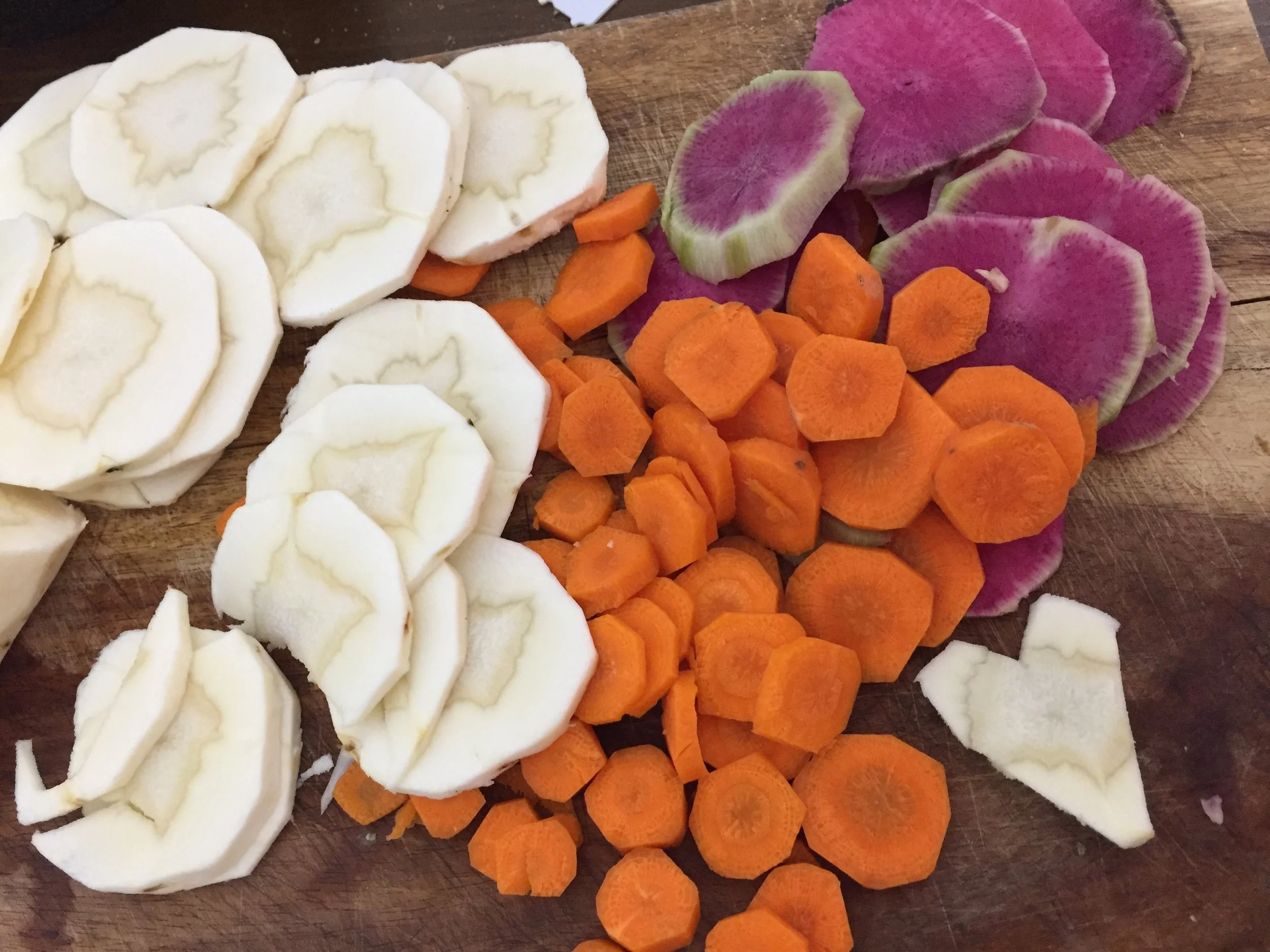 Add olive oil to the skillet with diced garlic cloves. Afterwards (when garlic is aromatic) add the coined vegetables and salt and pepper