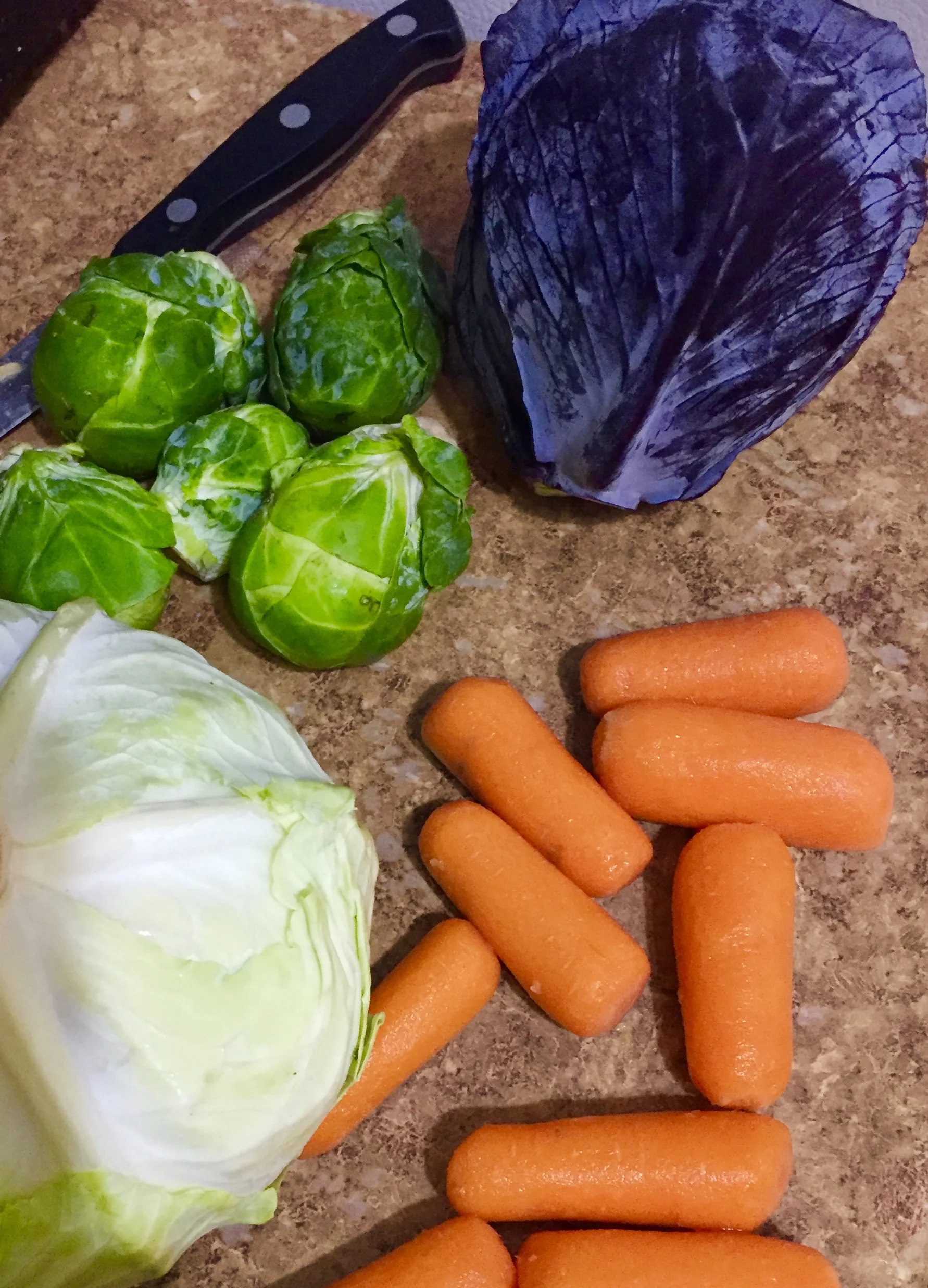 To make the basis for calling this "salad" chop the cabbage, Brussels sprouts, scallions and carrots. Dice the cilantro and put it aside.&nbsp;