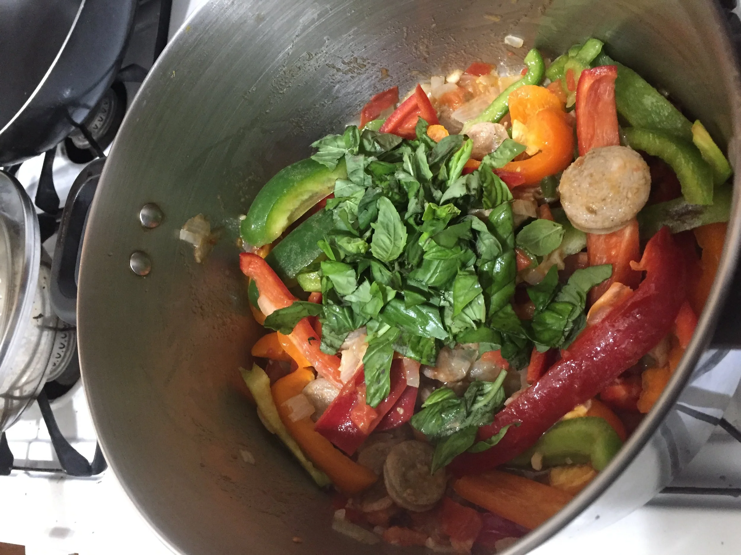 Add the Peppers to the pot. Chop a sizable handful of basil and add to the pot. Stir ingredients throughly and then cover for 25-30 minutes, or until the peppers cook down. In the last 5-6 minutes, add 2-3 tbls of brown sugar (to taste) and then add…