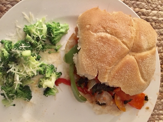 Spoon onto a hard roll and add shredded parmesan cheese on top before adding the lid. Serve Hot and with a vegetable on the side (Suggestion pictured- garlic broccoli with grated parmesan). My Comments: I made this recipe from scratch so I have found (of course) a few edits. I would use Portuguese Ciabatta Rolls in lieu of traditional hard (kaiser) rolls because they have more substance than traditional hard kaiser rolls. There are a myriad of chicken sausage varieties and this particular brand does not have a high salt content, which is definitely my own departure from traditional Italian sausages, so have a measured approach to seasoning with sugar (and know you might have to add more salt than anticipated). I would consider adding some heat to the mixture in the way of red pepper flakes or even a chili pepper in future batches. I am planning on serving the leftovers of the mixture over penne, and the actual gravy created while cooking is gonna be awesome over pasta. If I had thought about it, I would have browned the sausage coins in the pot before everything, to give them the traditional crunch of sausage and peppers (which you get generally from sautéing them in the pan beforehand). Generally chicken sausages are precooked (this brand is), so it is more of a flavor/taste preference issue than an issue of health and hygiene. 