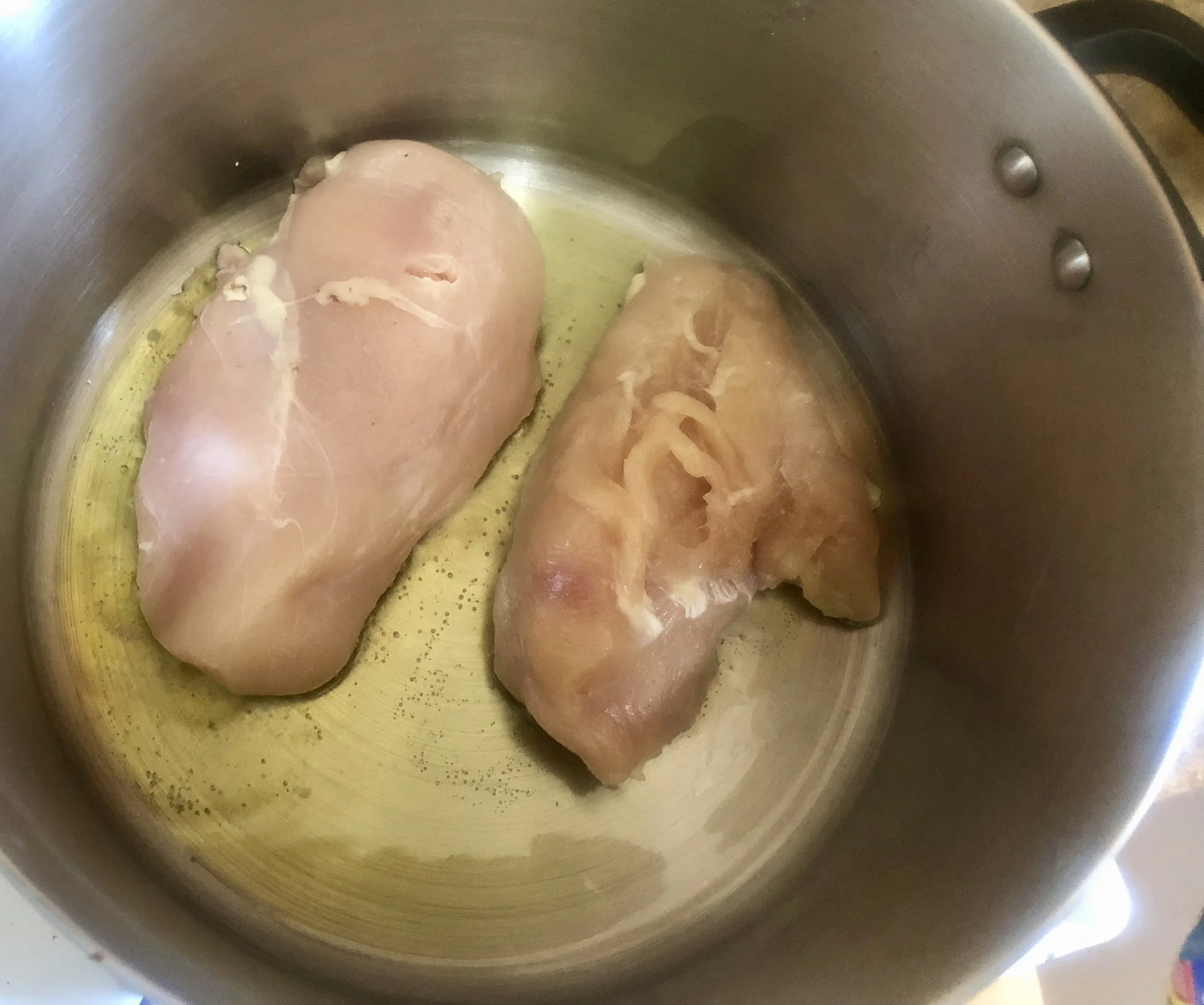 Cook breasts on both sides for 5-6 minutes each on Medium heat. Add 2 cups of chicken stock (made with Goya seasoning but you can use whatever chicken stock works.)