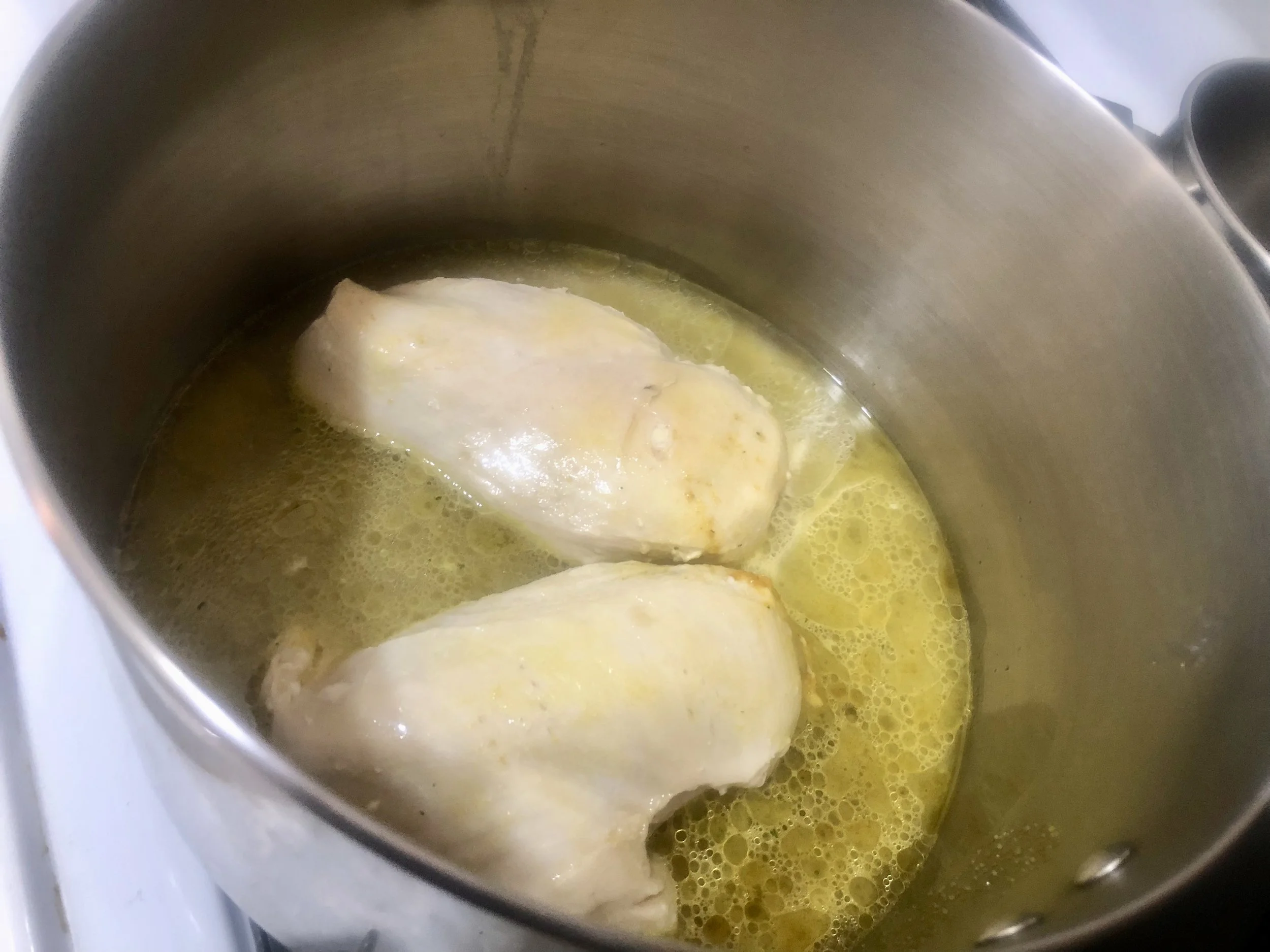 Cook Chicken breasts with the lid on until a meat thermometer read 160 degrees (apx 9-11 minutes). Remove from heat and put aside.Roast the Tomatoes: Preheat the oven to 350. Core and De-seed the tomatoes. Chop them into bite size pieces.