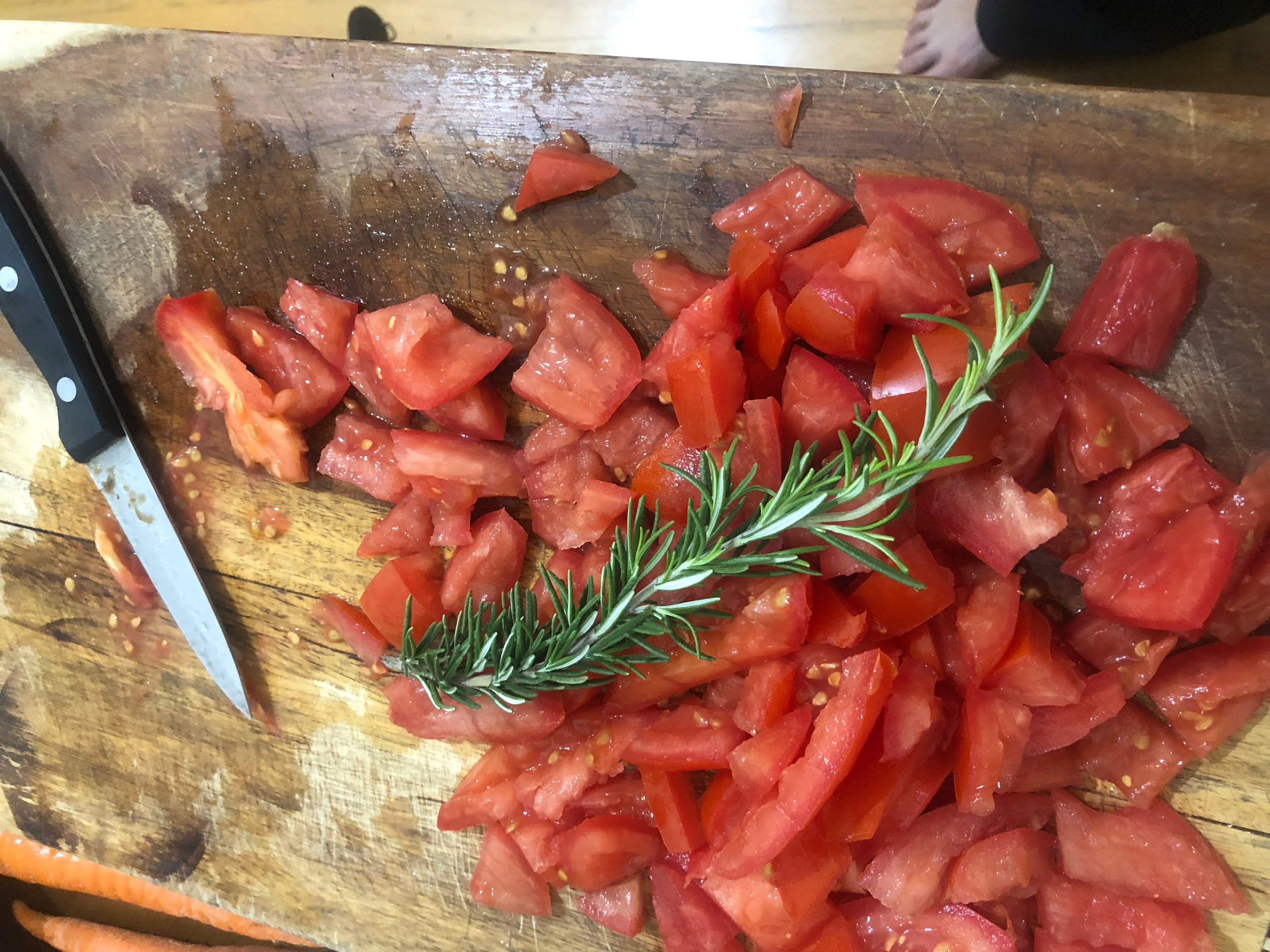 Take the Rosemary sprigs, remove the leaves from the stalk and chop the leaves finely