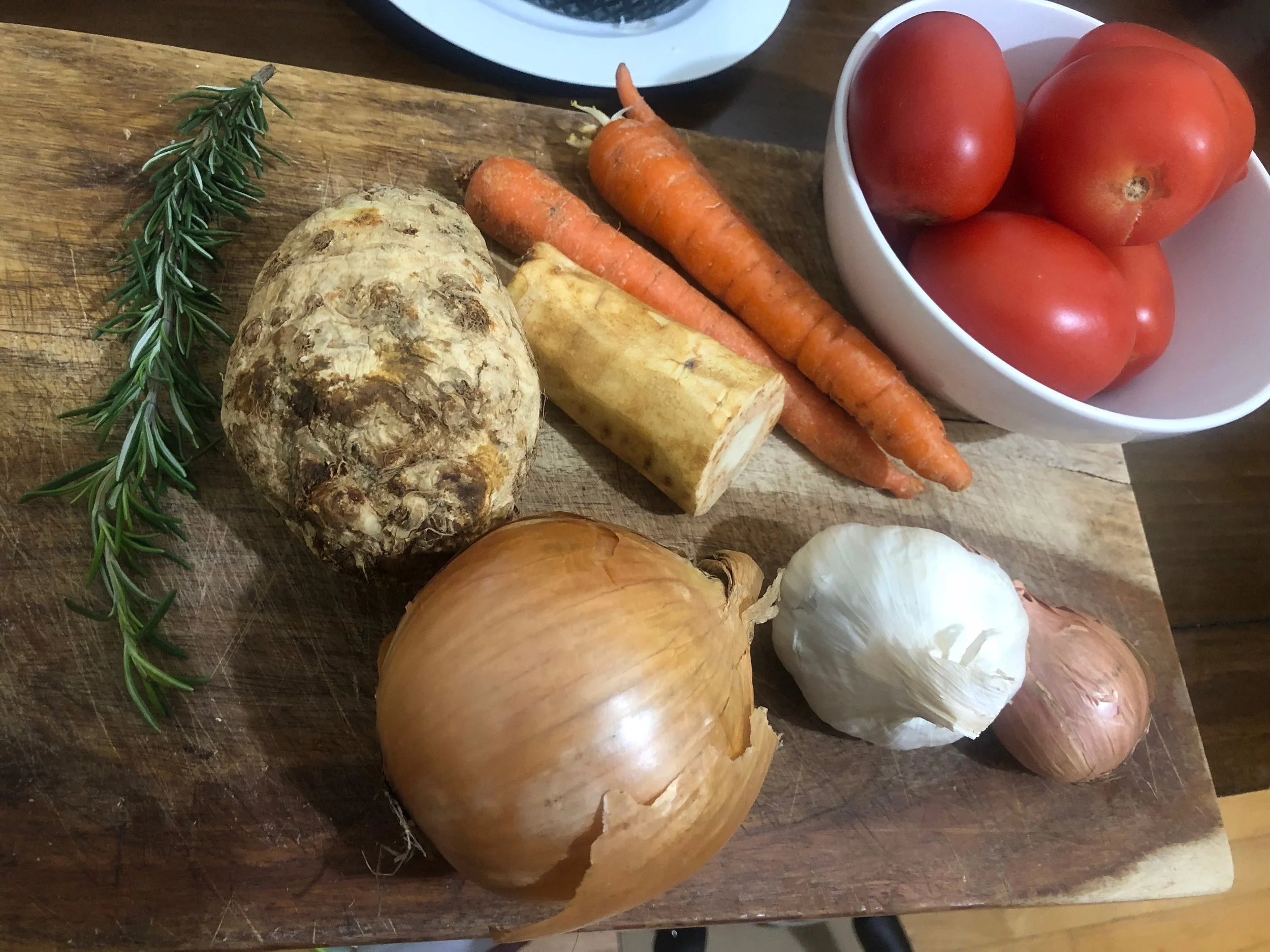 While the onion and garlic cook, coin the carrots and parsnip, and cut the celery root into bite sized thin strips. Add the vegetables, and six cups of chicken stock into the pot. Put the lid on and cook until vegetables are cooked through.&nbsp; 