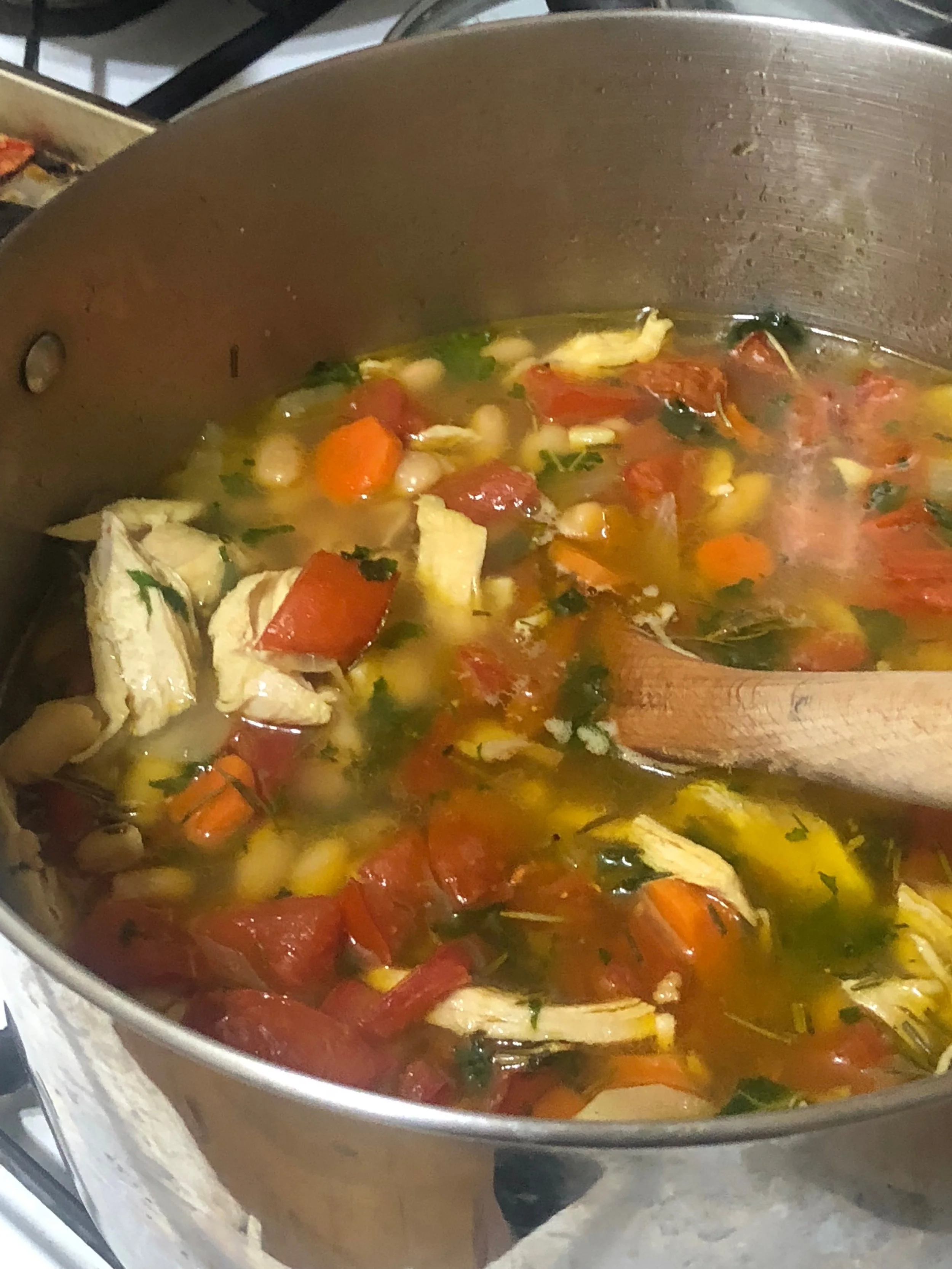 Add the roasted tomatoes to the pot. Shred the kale, remove the soup from the heat and add kale to the soup. Add as much Kale as your palate is interested in and ENJOY! Consider this lady a food psychic- I see many empty soul bowls in your future!