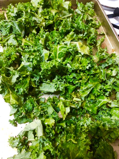 Ingredients 2-3 Cups of Raw Kale, cleaned and chopped into bite size pieces salt and pepper powdered garlic parmesan ( for grating on top) Olive Oil (liberal amount Directions: Preheat the oven to 390 Liberally coat the kale with olive oil and spread on your baking sheet. Season with salt, pepper and garlic (keeping in mind the Parmesan cheese you're gonna add has a high sodium count). Grate parmesan cheese on top of the kale, with as much abundance as meets your personal love of cheese..and all things correct in the world! I love cheese! Put the baking sheet into the oven and cook for 9 - 13 minutes until it achieves the appropriate amount of crunchiness...for your palate! Enjoy!
