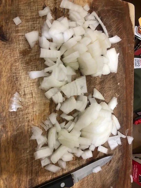 Dice onions and garlic