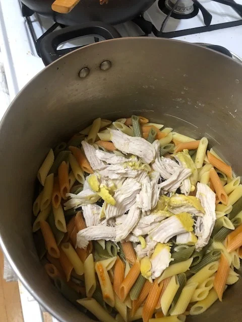 While the sauce is cooking, cook a medium box of penne (tricolor pictured) and poach 2 chicken breasts in chicken stock in a sm covered saucepan. Shred the cooked chicken and put on top of drained/cooked pasta.&nbsp;Pour some of the sauce generously…