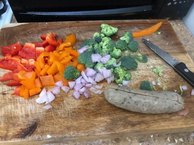 Dice the vegetables and cut the sausage into sm pieces.