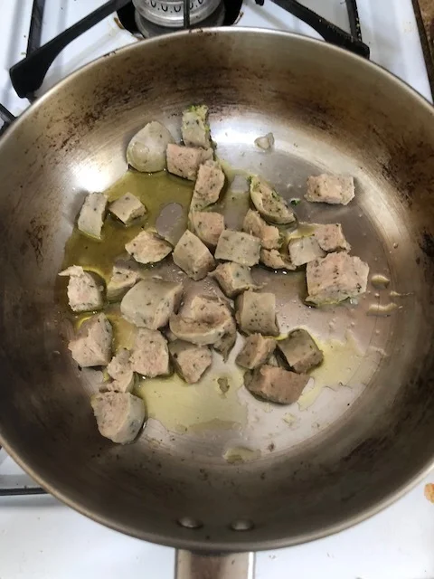 Add some of the olive oil to medium skillet and then add the chicken sausage pieces. This variety of chicken sausage is precooked, but I was interested in cooking them to get them to have the traditional crunch you would have with Italian Sausage.