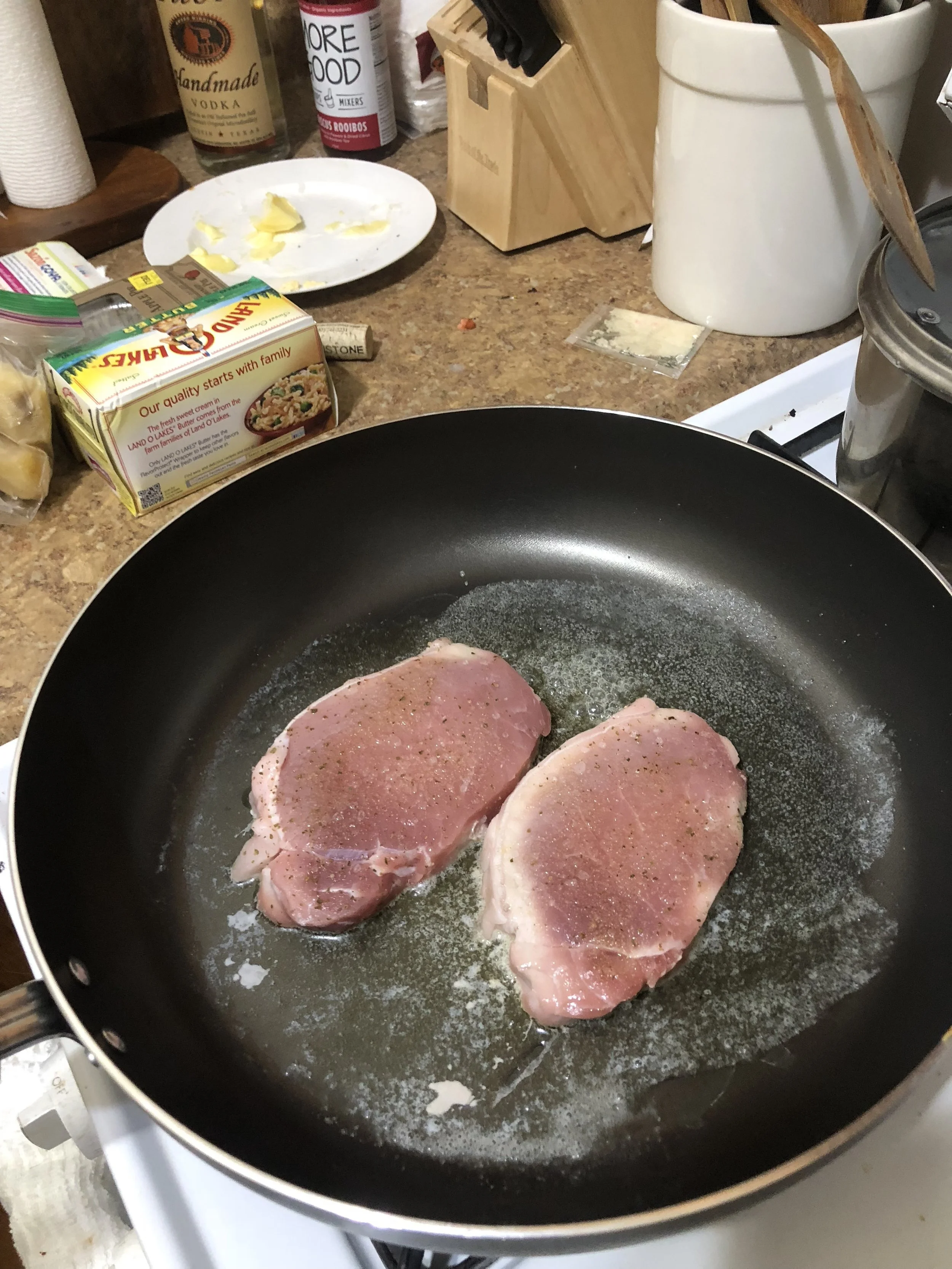 Put a generous pat of butter in a medium nonstick skillet and add in the porkchops