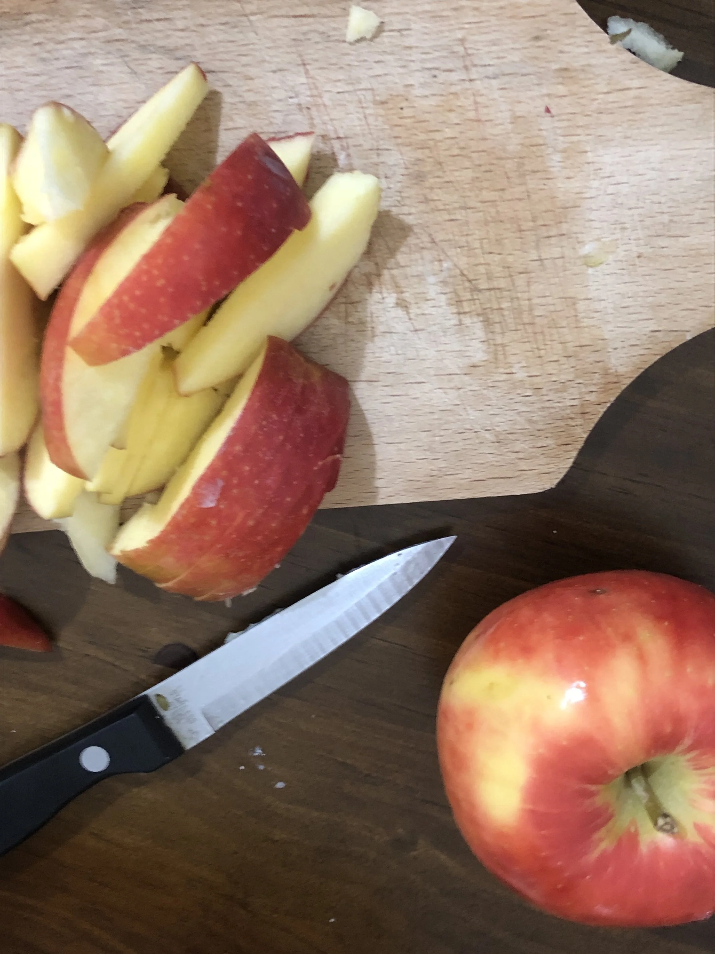 While the pork chops are cooking, peel and dice the garlic and slice the apple into very thin slices. Try and use very firm apples so so they hold up to cooking