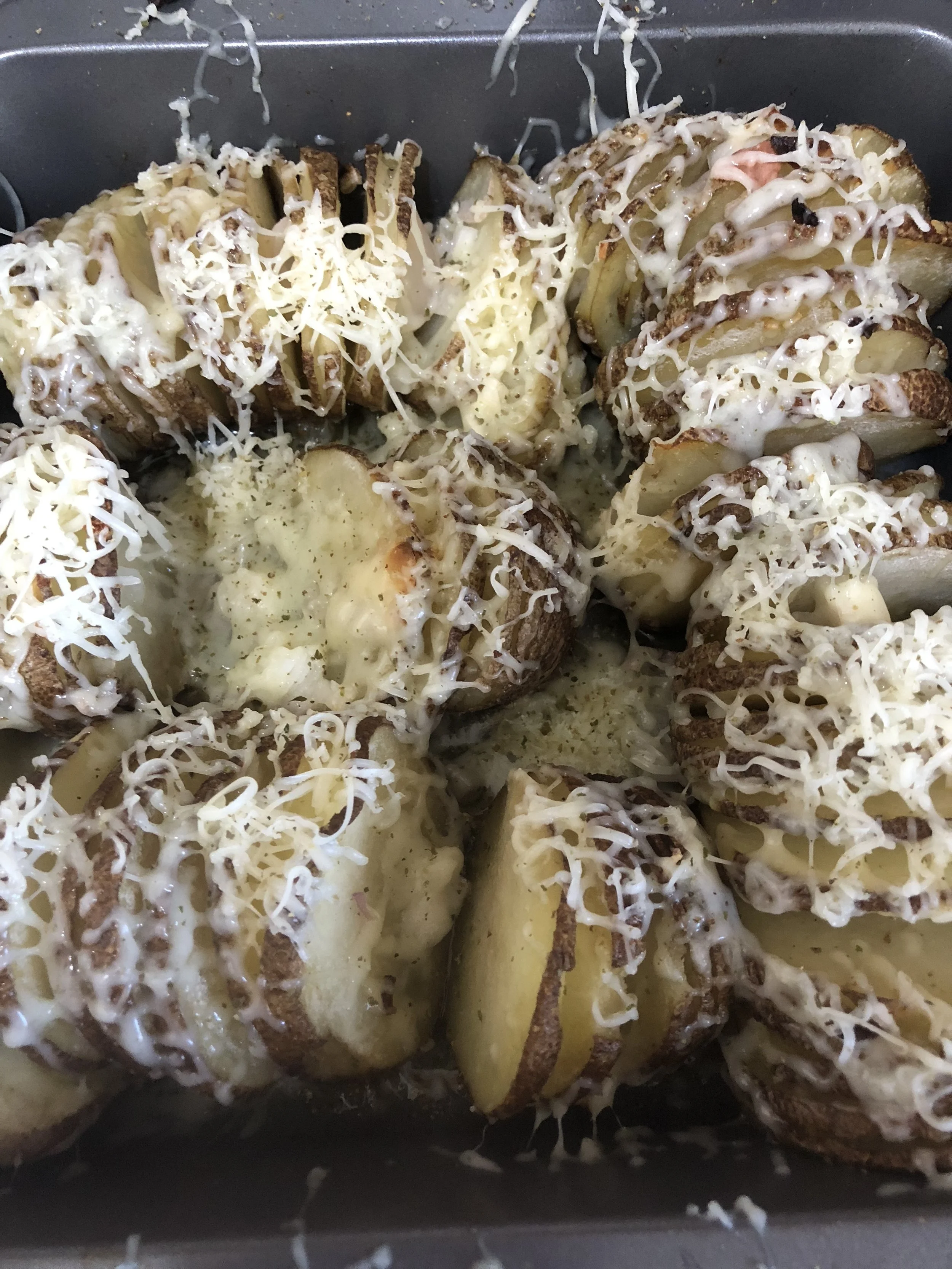 Pour horseradish cheddar over the potatoes and then add parmesan on top. Put in the oven for 30 minutes, checking often to ensure there are no unfavorably charred pieces. Remove and serve hot, wearing something sweet...unless you're cooking for your…