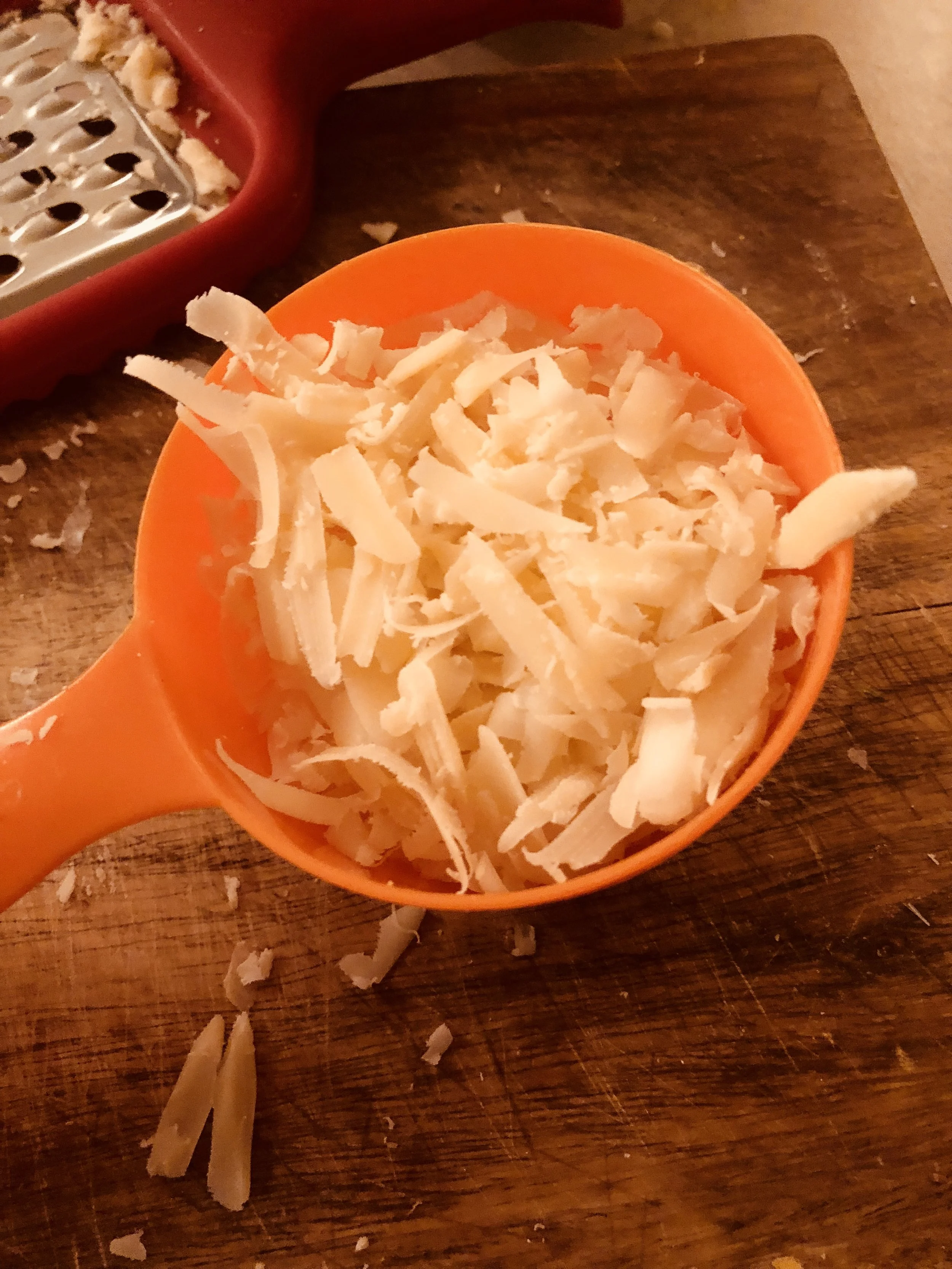 Put the parmesan in your mixing bowl. Shred 1.5 cups of an additional cheese, which should be pecorino, pecorino Romano, Parmesan reggiano, etc...I used Romano because my grocery store did not have other options.&nbsp;