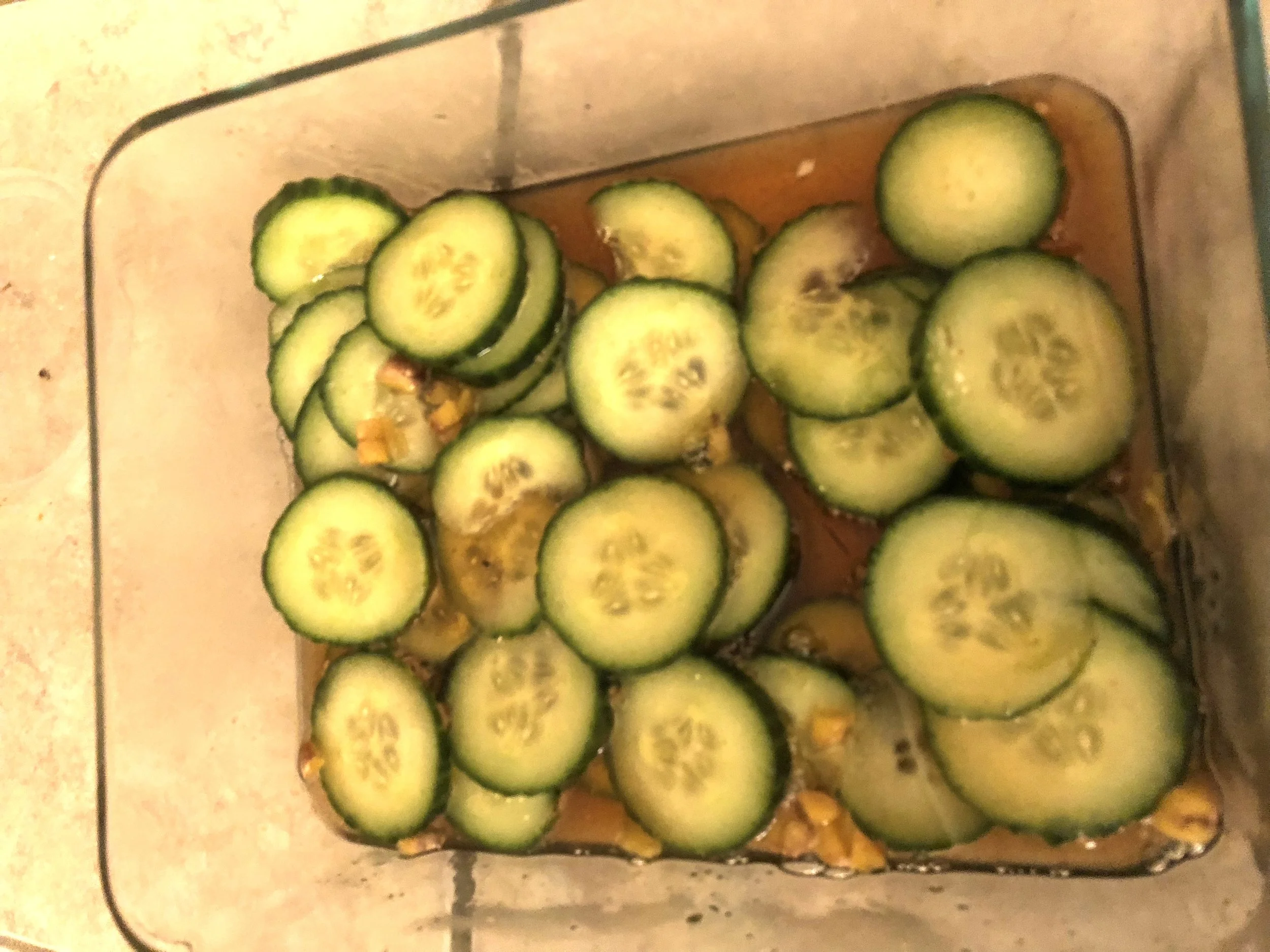 Ingredeints An English cucumber (you can spot them because they're the cucumbers in the produce aisle smoking pipes, dressed like Sherlock Homes, who are usually eating scones) Cup of Rice Wine Vinegar 0.25 cup of sugar tbls of sea salt 0.5 tsp of togarashi (or crushed red pepper) 1.5 diced/grated ginger Plan of Attack