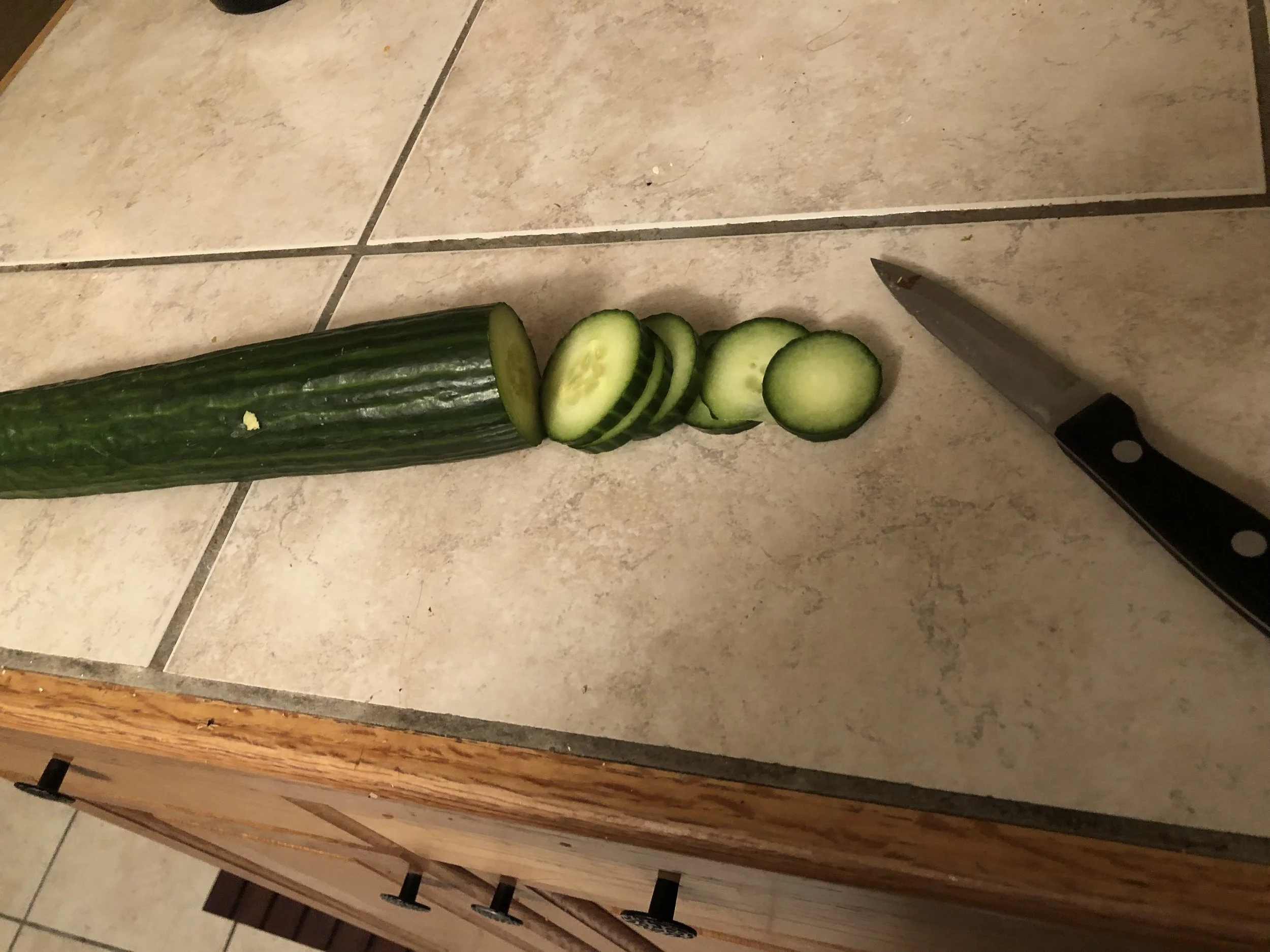 Slice the cucumber into thin coins.