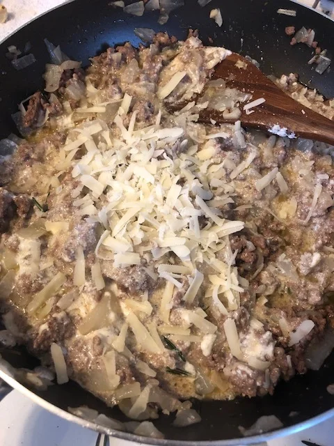 Mix the mixture together, and add more cheese according to your palate. *In this photo, I have just added more parmesan*. Let the mxiture cool. It should be the consistency necessary to form sm balls and maintain its shape.While the meat filling is …
