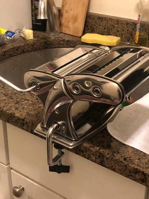 I used the hand crank pasta machine I bought after my ravioli class training, and it worked well, despite my counter top lip not having the exact space ideal for clamping on.If you are using a hand crank machine:&nbsp;Put your dough in two balls. Be…