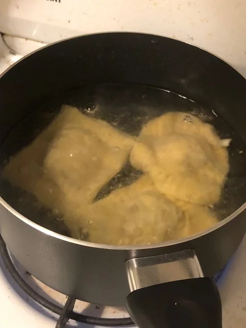 Add the ravioli, in batches, to your pot of boiling water. Initially they'll sink, and when they float to the top they're done cooking!&nbsp;