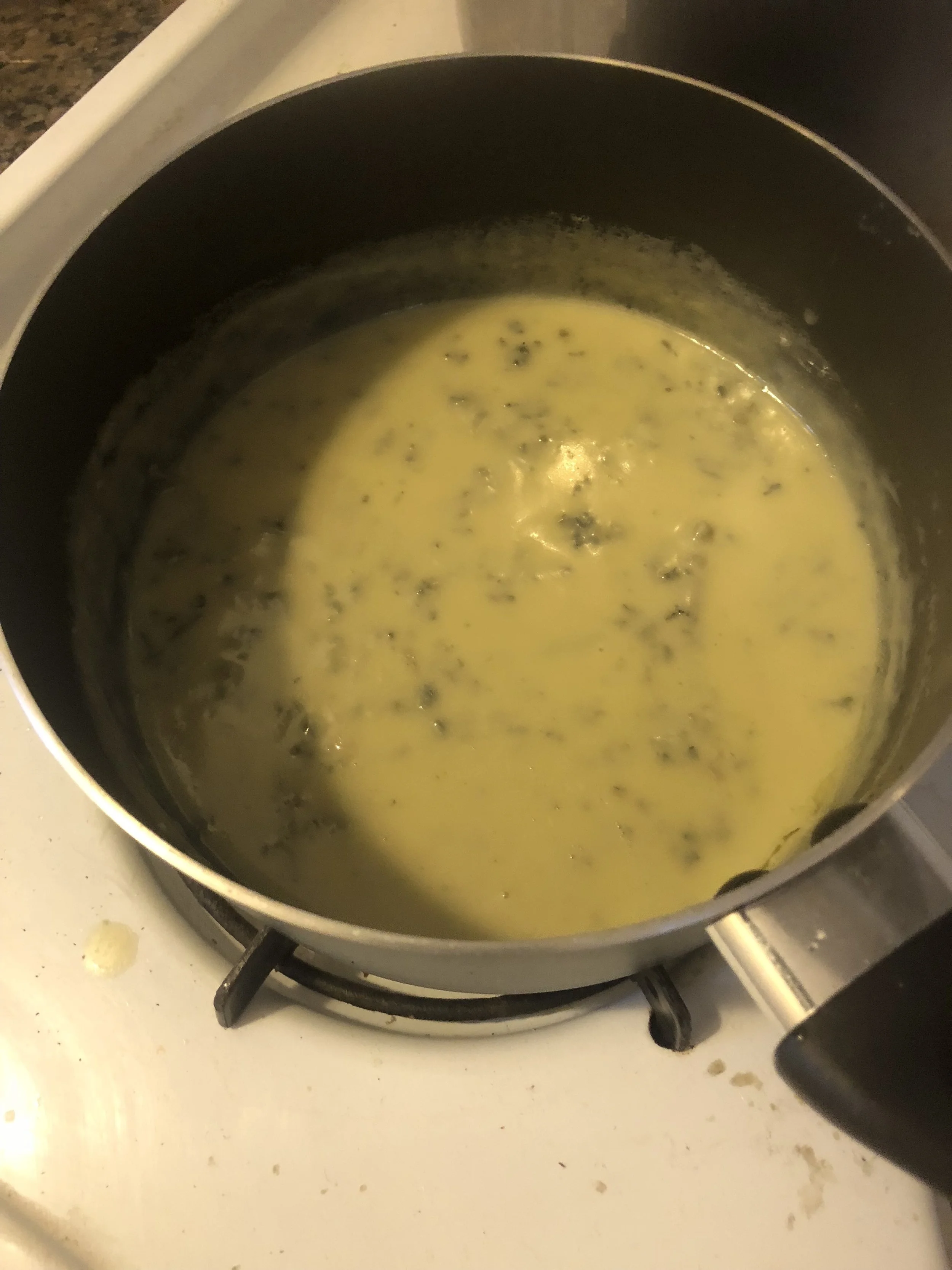 When sauce is melted remove from heat and put to the side while the pasta cooks. Taste and add powdered garlic and pepper according to your preferences.&nbsp;Drain the pasta, reserving some of the past water. Add the cheese sauce, the red pepper dic…