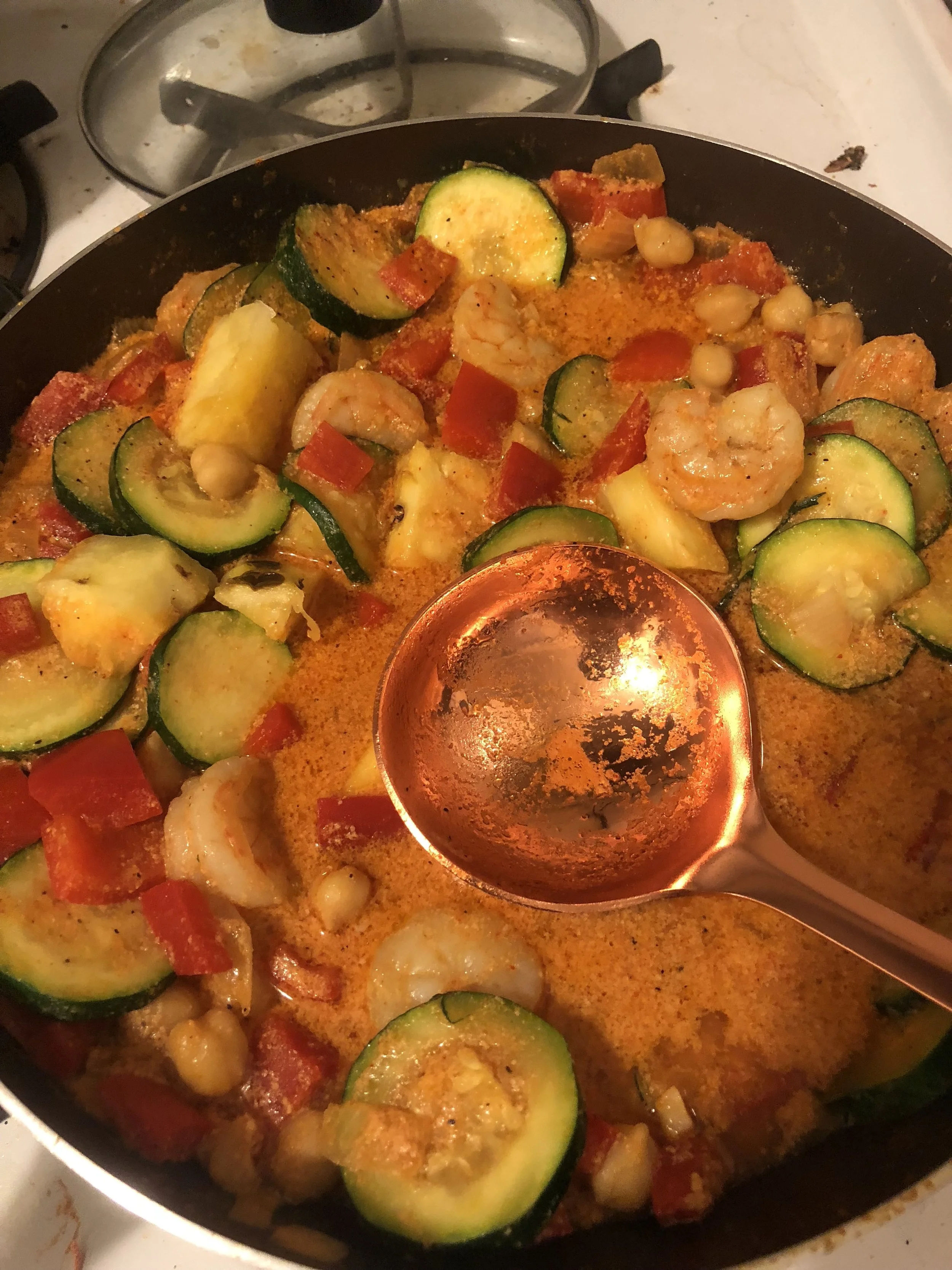 Ingredients 2 zucchini 2 red peppers 05. can of garbanzo beans 2-3 tbls of Thai red chili paste 3-5 cloves of garlic medium onion lb of medium shrimp ( thawing, cleaned and deveined) 13.6 can of coconut milk olive oil salt and pepper (to taste) Cored, peeled and diced pineapple (apx cup) crushed red pepper (to taste)