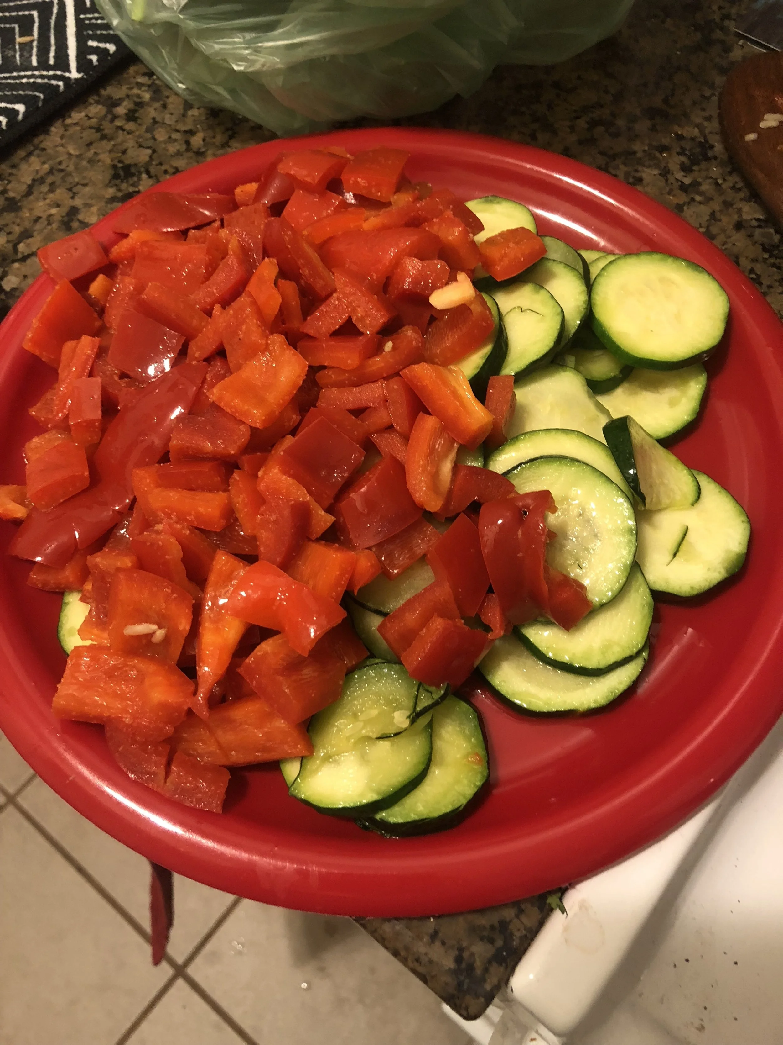 When peppers have cooked through, remove them from your pan and place on the plate wit the zucchini. Add olive oil to the pan and add onions and garlic.