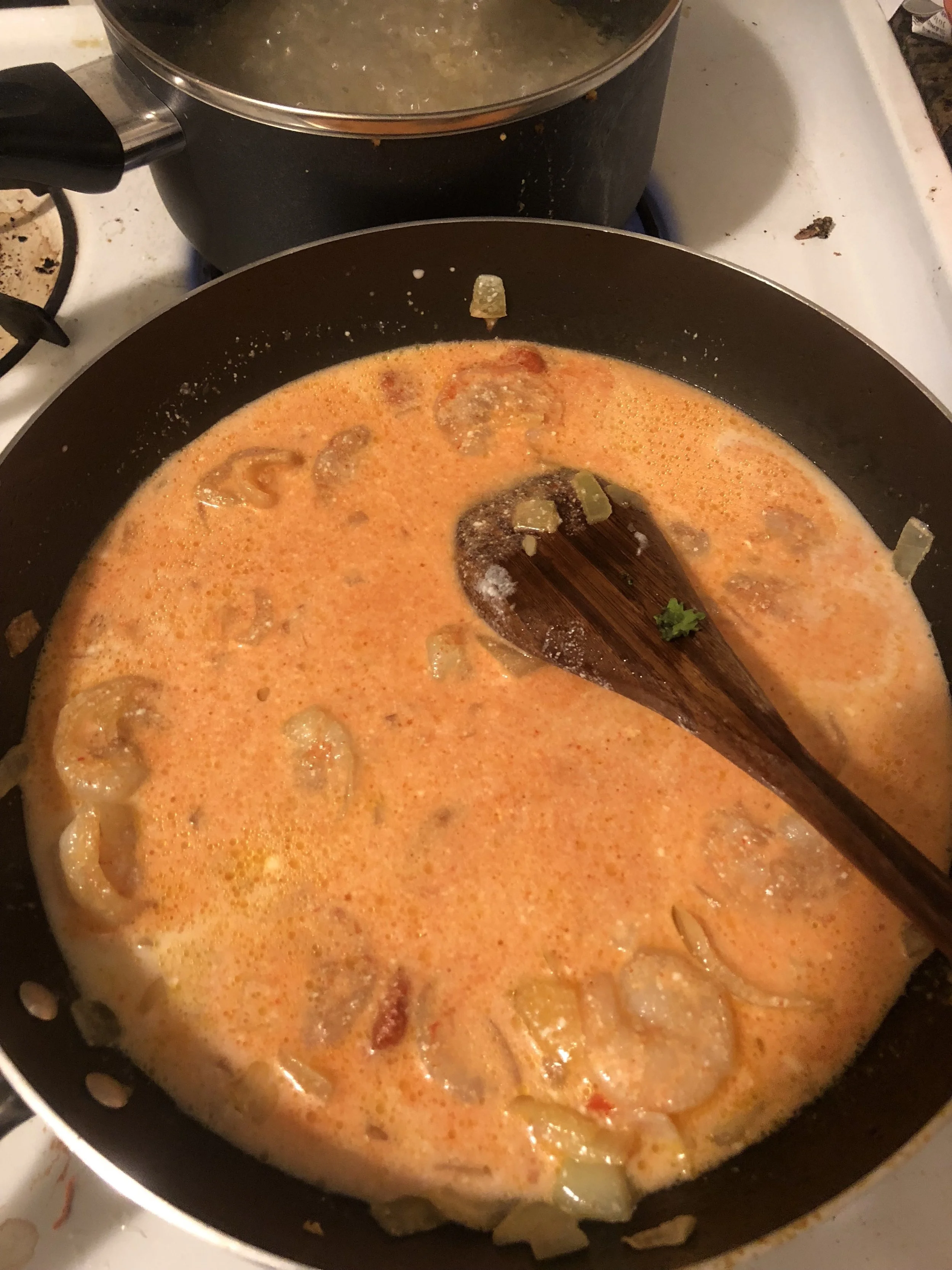 Add your can of coconut milk and red Thai chili paste to the pan. Turn heat up and bring the sauce to a boil for 5-6 minutes.&nbsp;