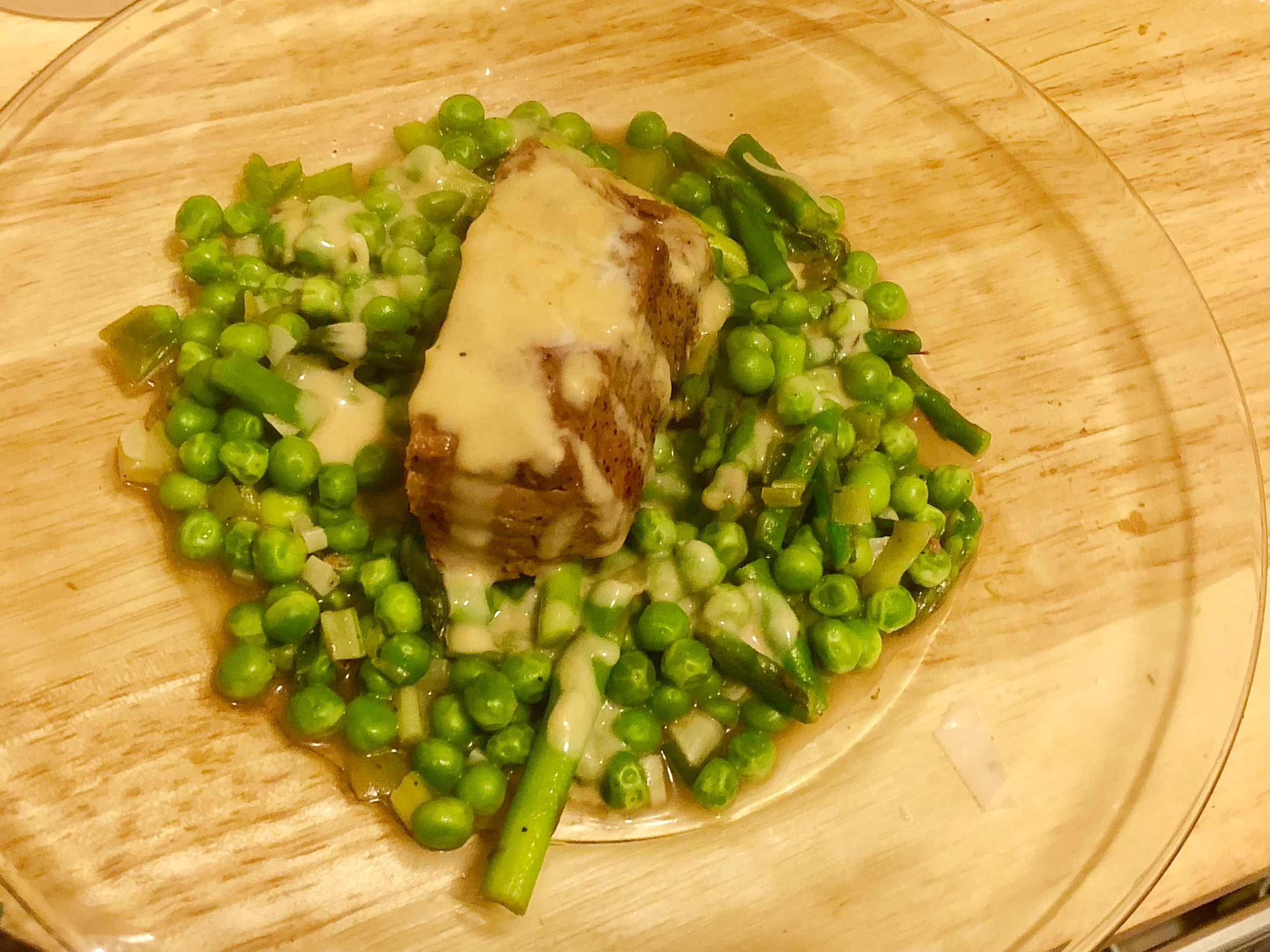 b of boneless steak ( I opted for London broil) 3 pats of butter 11 ounces of frozen peas bunch of asparagus salt and pepper bunch of scallions 2 -3 cloves of garlic cup of mustard 2 tbsp of honey tsp of red wine vinegar horseradish (according to your preferences- if ya don't add you'll miss the spice) tsp of cayenne powder
