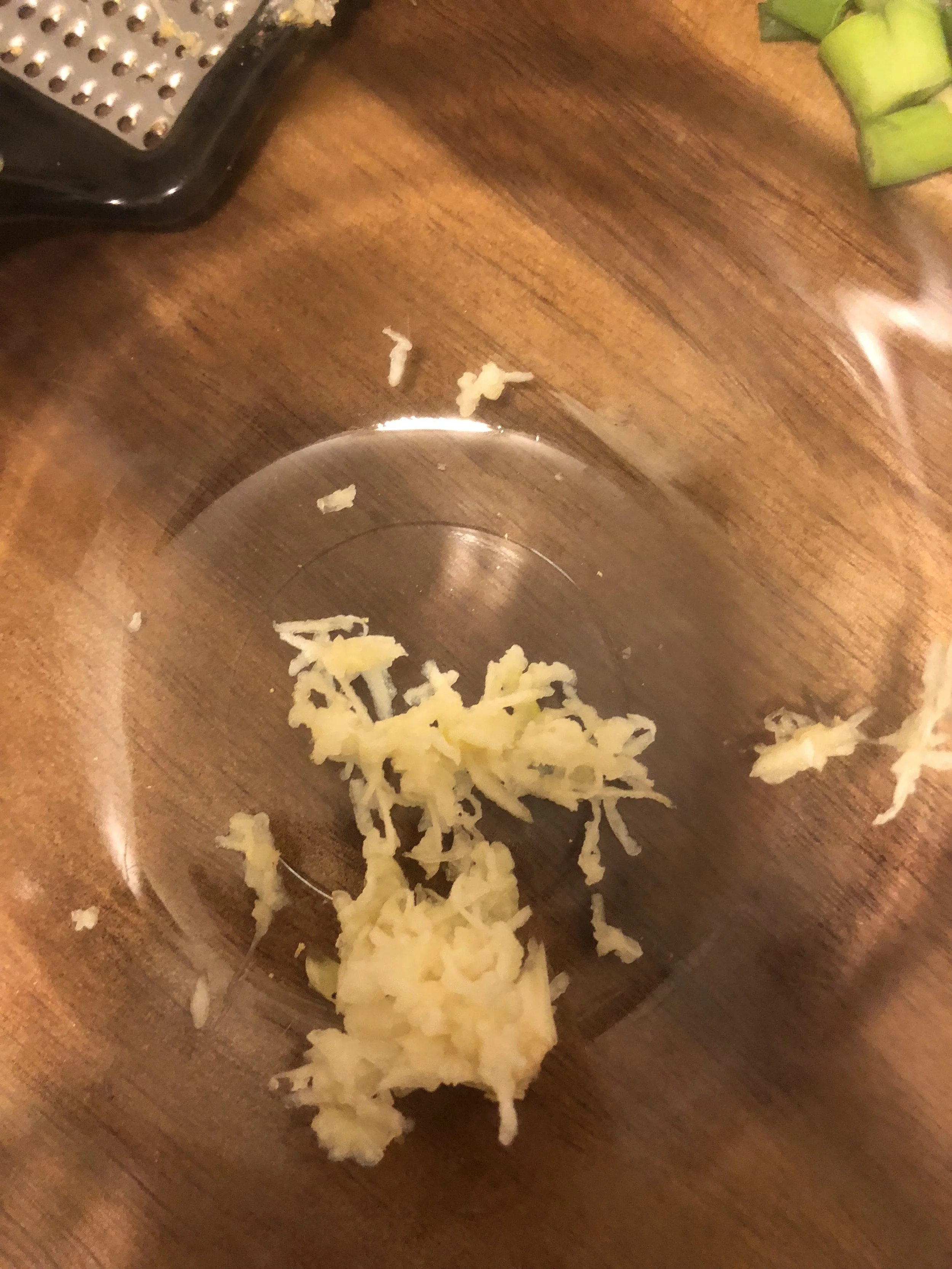 Grate the garlic cloves finely