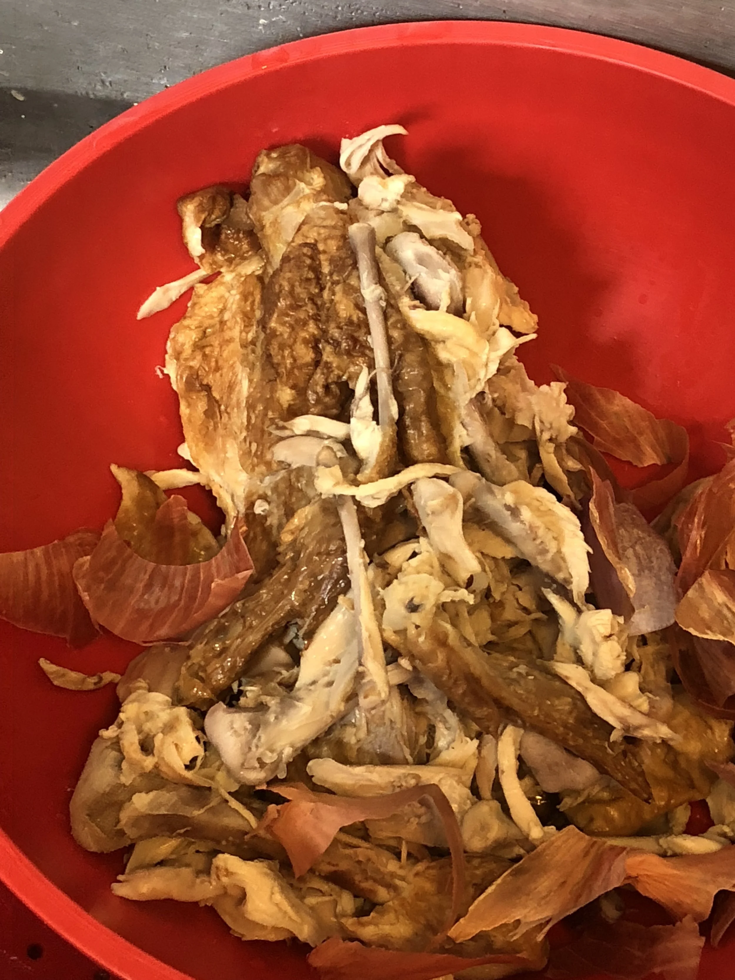 Clean your chicken and submerge in a stockpot. Add 2 sprigs of rosemary. Turn on medium heat.