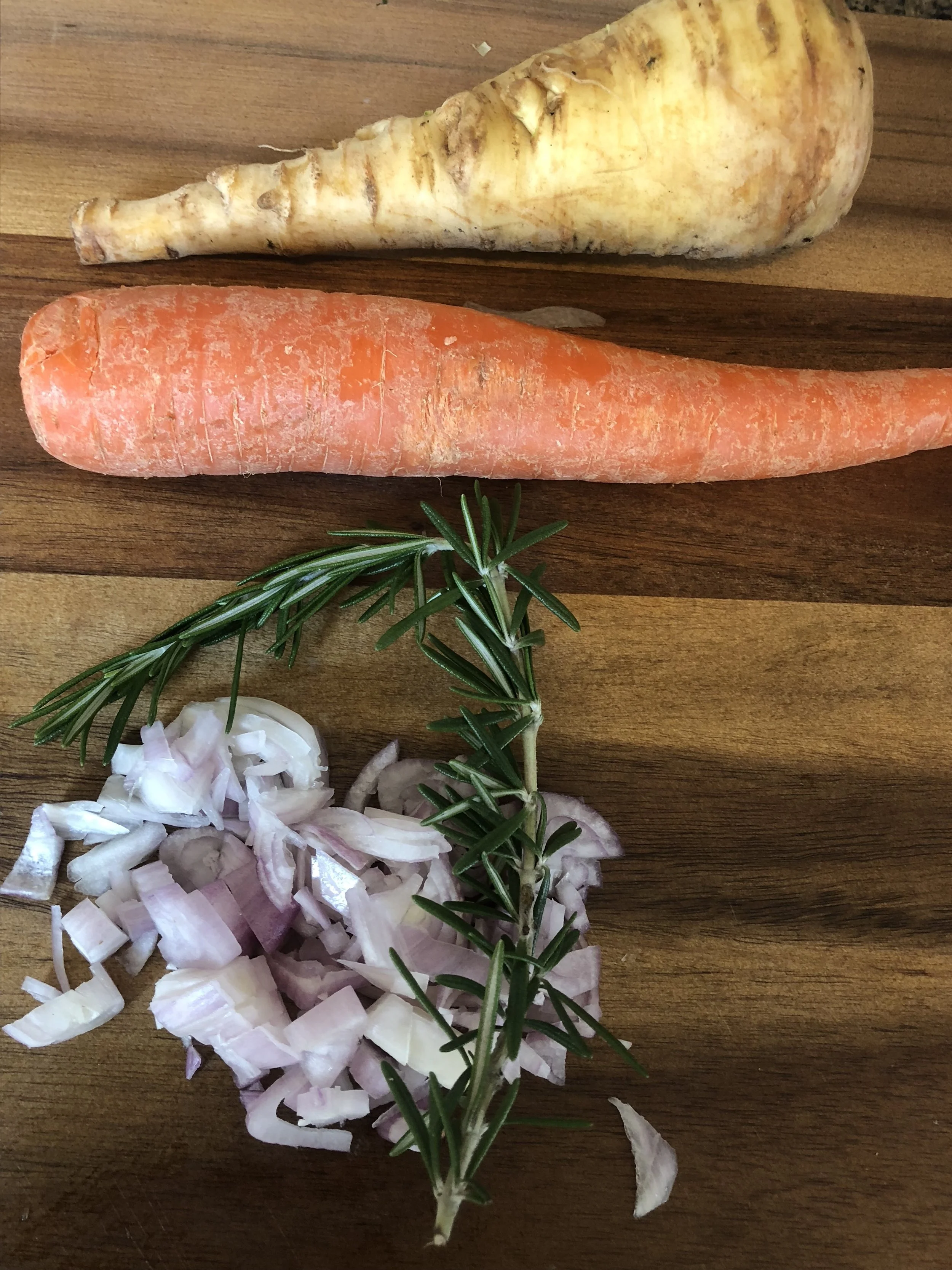 Dice your onions and shallots. Add 2 tsp of butter or olive oil to the bottom of your stockpot and then add onions and garlic, cooking until clear and aromatic. Then add the reserved chicken stock, coined carrots, cleaned and coined parsnips, anothe…