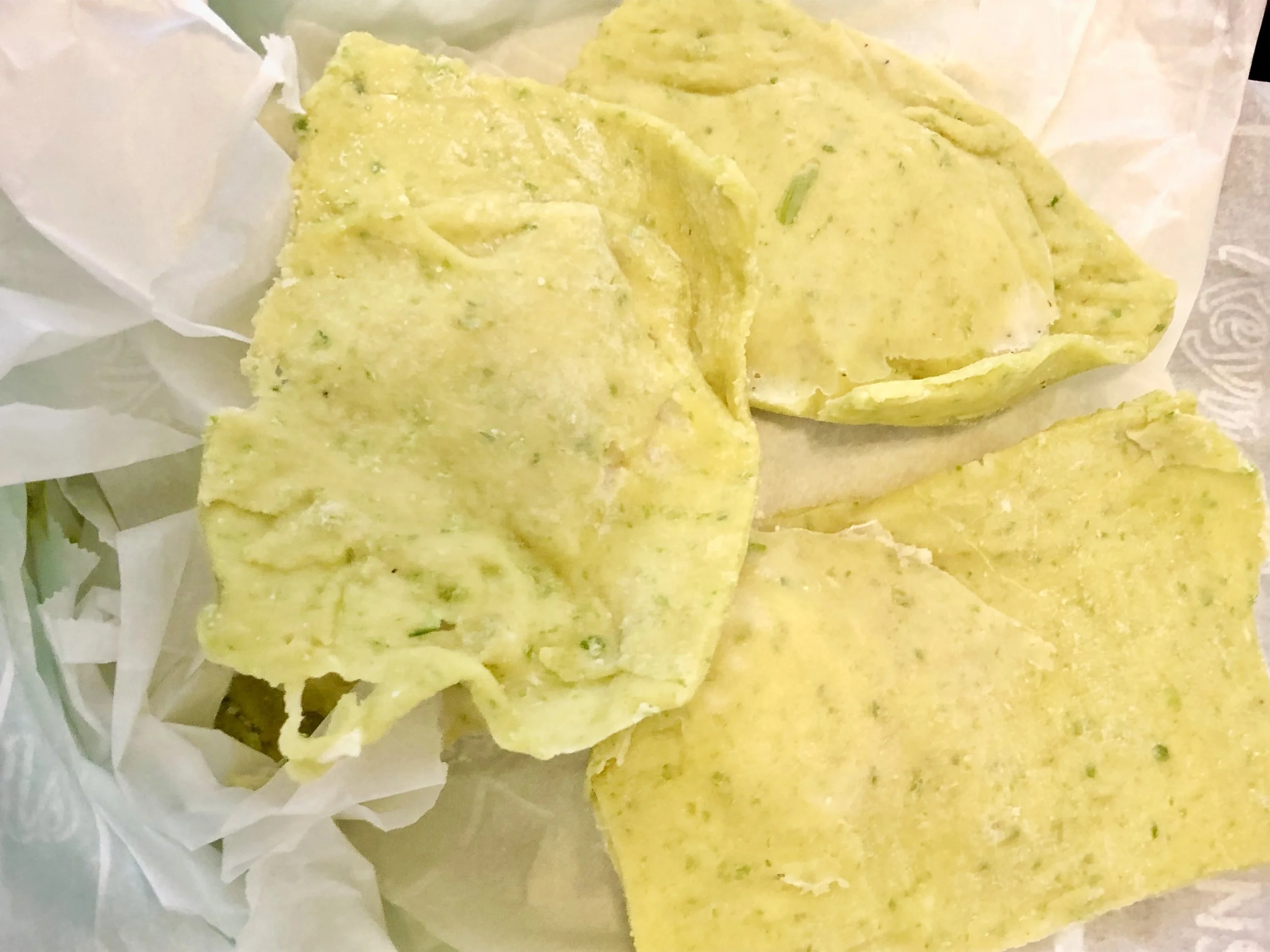 Pictured: Frozen ravioli and parchment paper