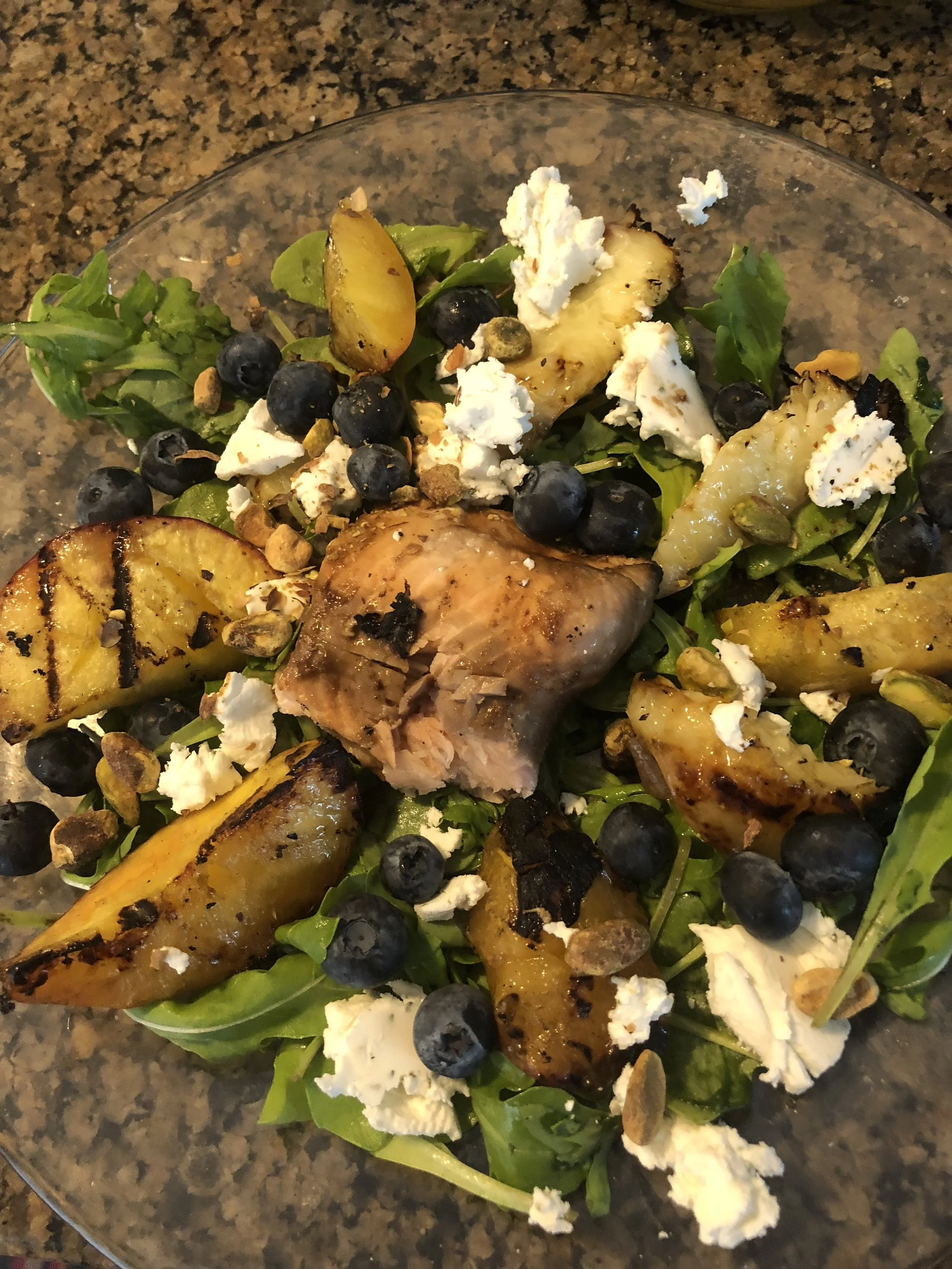Mix the dressing ingredients and whisk ( I didn't but it is advisable).Slice the nectarines, arrange on top of the arugula, sprinkle blueberries, crumble goat cheese and add pistachios.Drizzle the dressing over the top of the salad and enjoy!My comm…