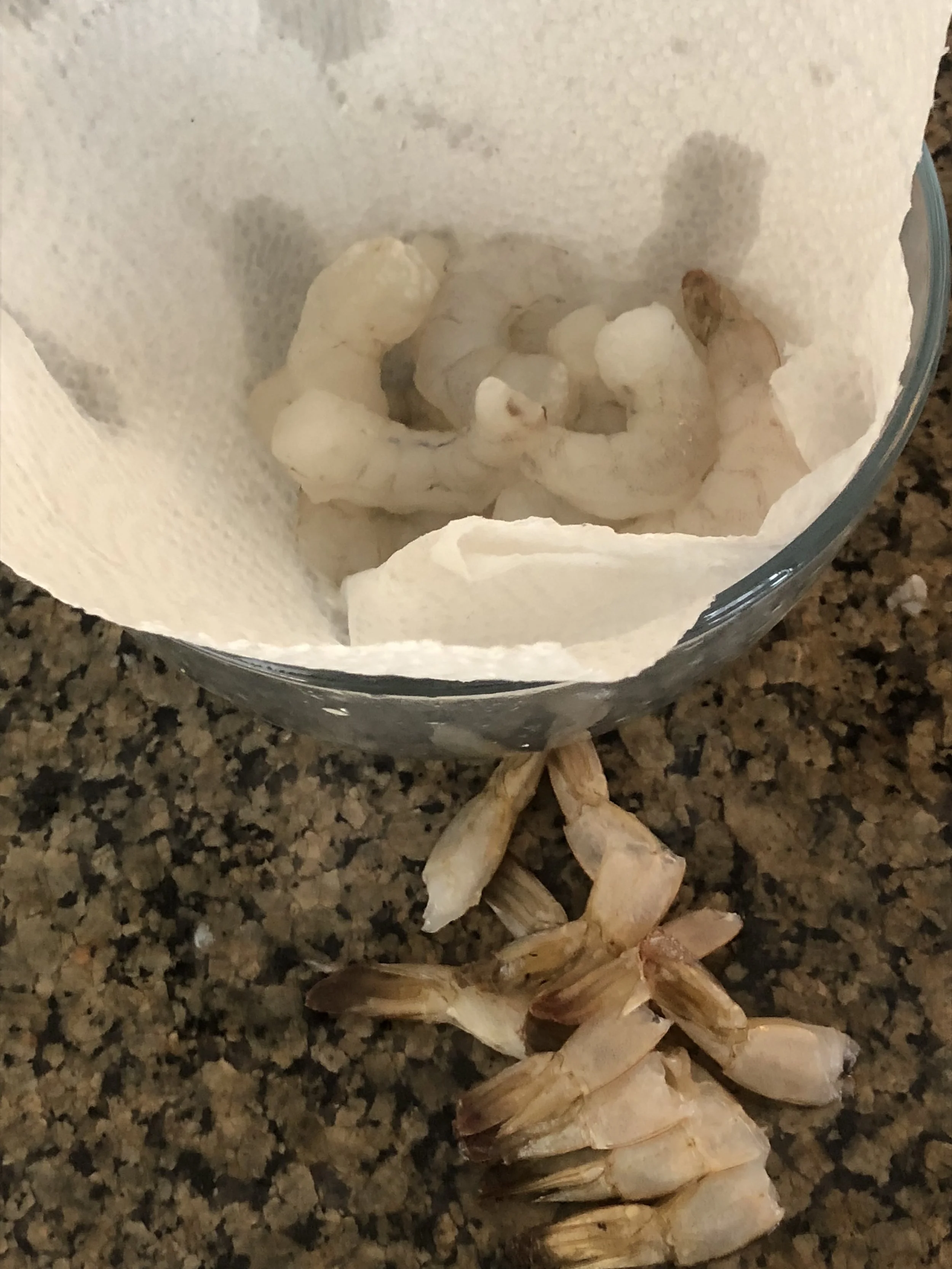 Defrost (if necessary), clean and detail/devein the shrimp. Rinse under cold water. Draping a paper towel over the bowl to catch the excess water, helps keep the shrimp crisp.