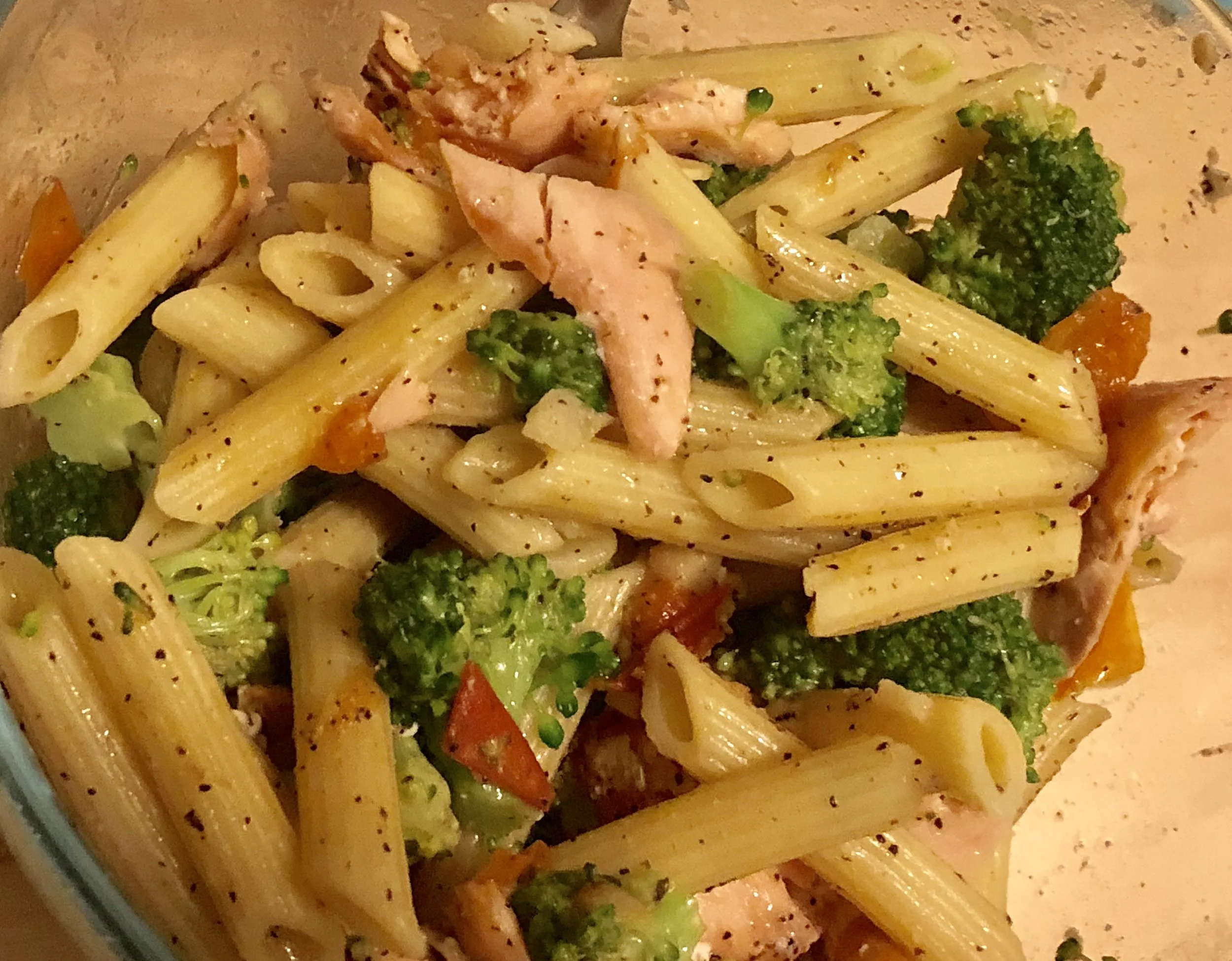 Ingredients salmon fillet sm-medium tomato 2-3 garlic cloves head of broccoli 2 tbs of butter or margarine 2 cups of penne pasta salt and pepper (to taste) Plan of Attack Preheat the oven to 350 degrees season the salmon with salt, pepper and garlic. Coat the salmon with olive oil and then place on the pan. Place the salmon in the oven and cook until thoroughly cooked. Add the butter to your medium skillet and clean and dice the garlic cloves. Cook until aromatic and then ad the tomato, diced in sm pieces. Cut the broccoli into bite sized pieces and then add into the skillet. Cook until broccoli is done, adding olive oil and/or butter as needed. As the broccoli cooks, bring water to boil in your saucepan and when boiling, add the pasta. Cook until al dente. Add the drained pasta to the mediums skillet and mix to coat pasta. Flake the salmon and add the fish to the medium skillet. Serve hot and smiling.