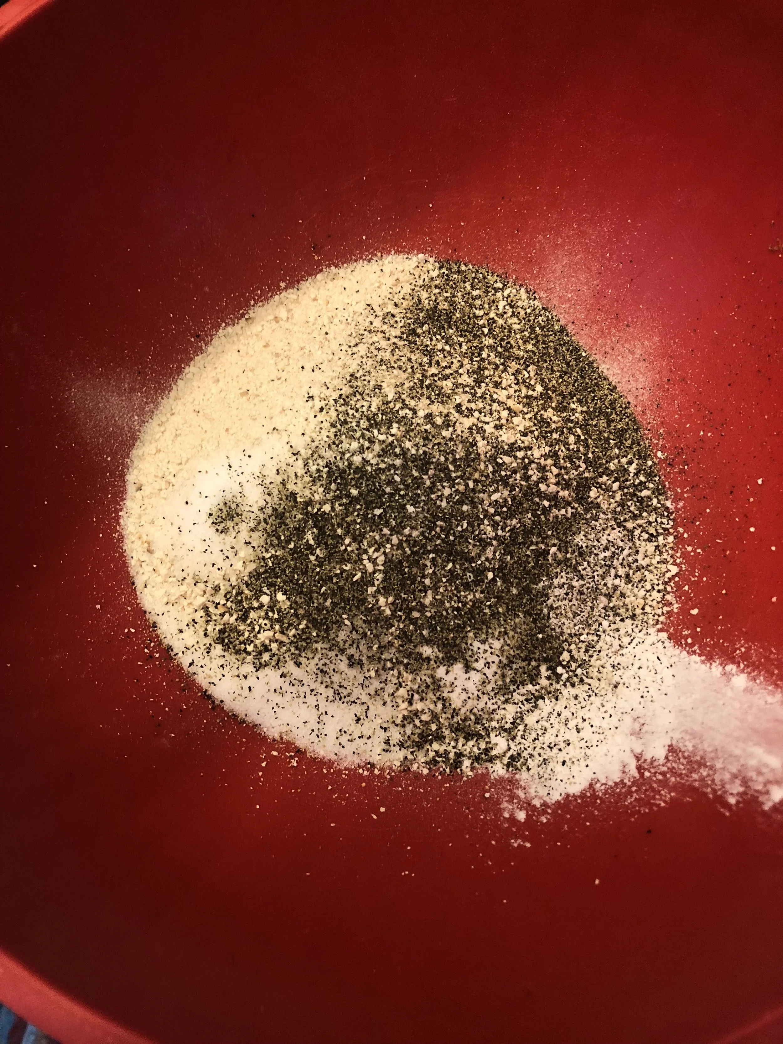 Add the matzo meal, baking powder, baking soda, salt, and pepper pepper. Mix.