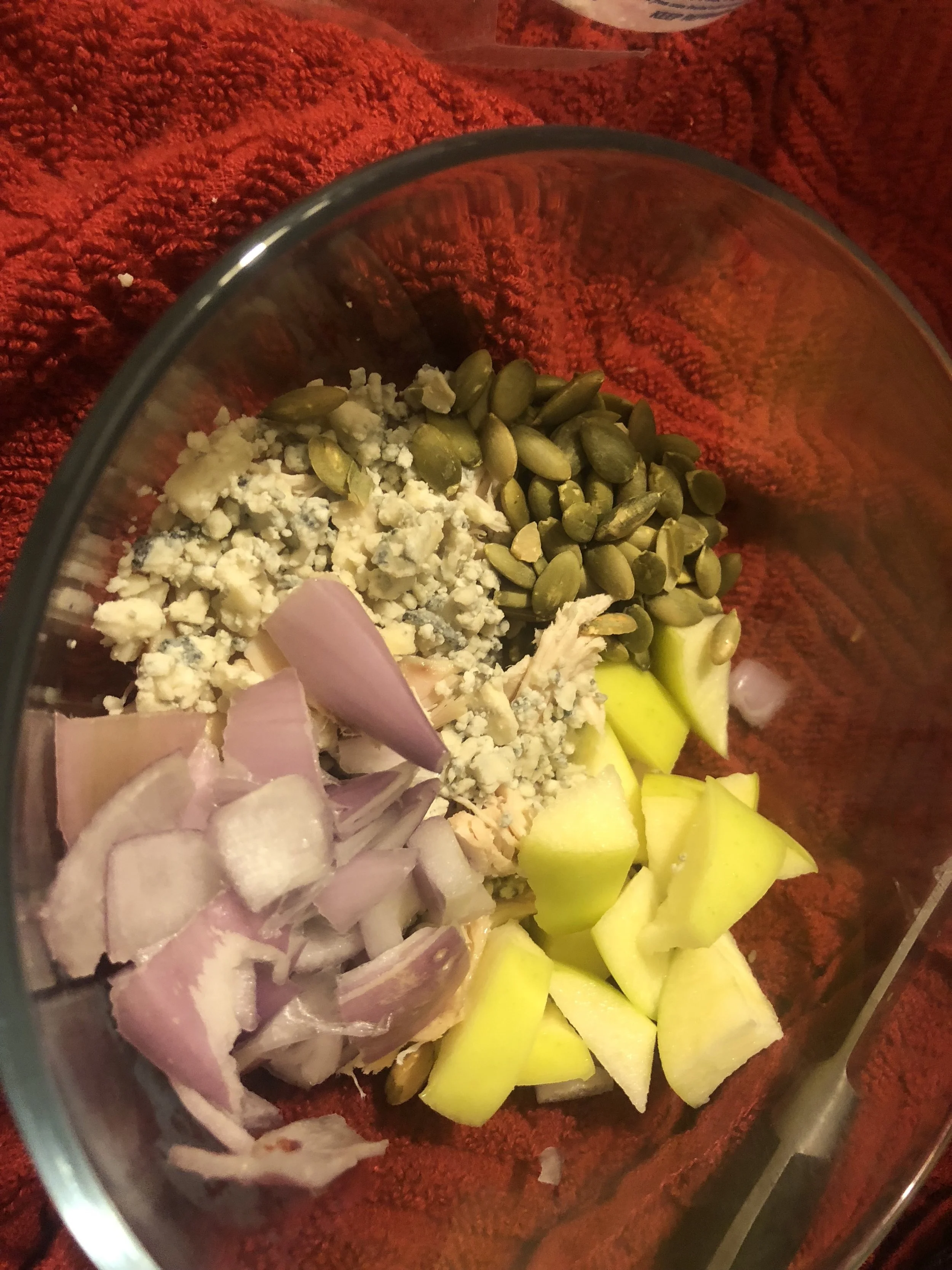 Ingredients sm shallot shredded medium chicken breast (I used rotisserie chicken) 0.5 medium apple 2 tsp of Gorgonzola cheese crumbles 3 tbls of pepitos (pumpkin seeds) 3 tsp of light mayonnaise ground pepper to taste Bread (I used an egg bagel for more substantiality but you can use whatever you have around…an baguette might work well as well) Plan of Attack Mix all the ingredients together throughly and pepper according to your taste. Salad should make two hearty sandwiches.