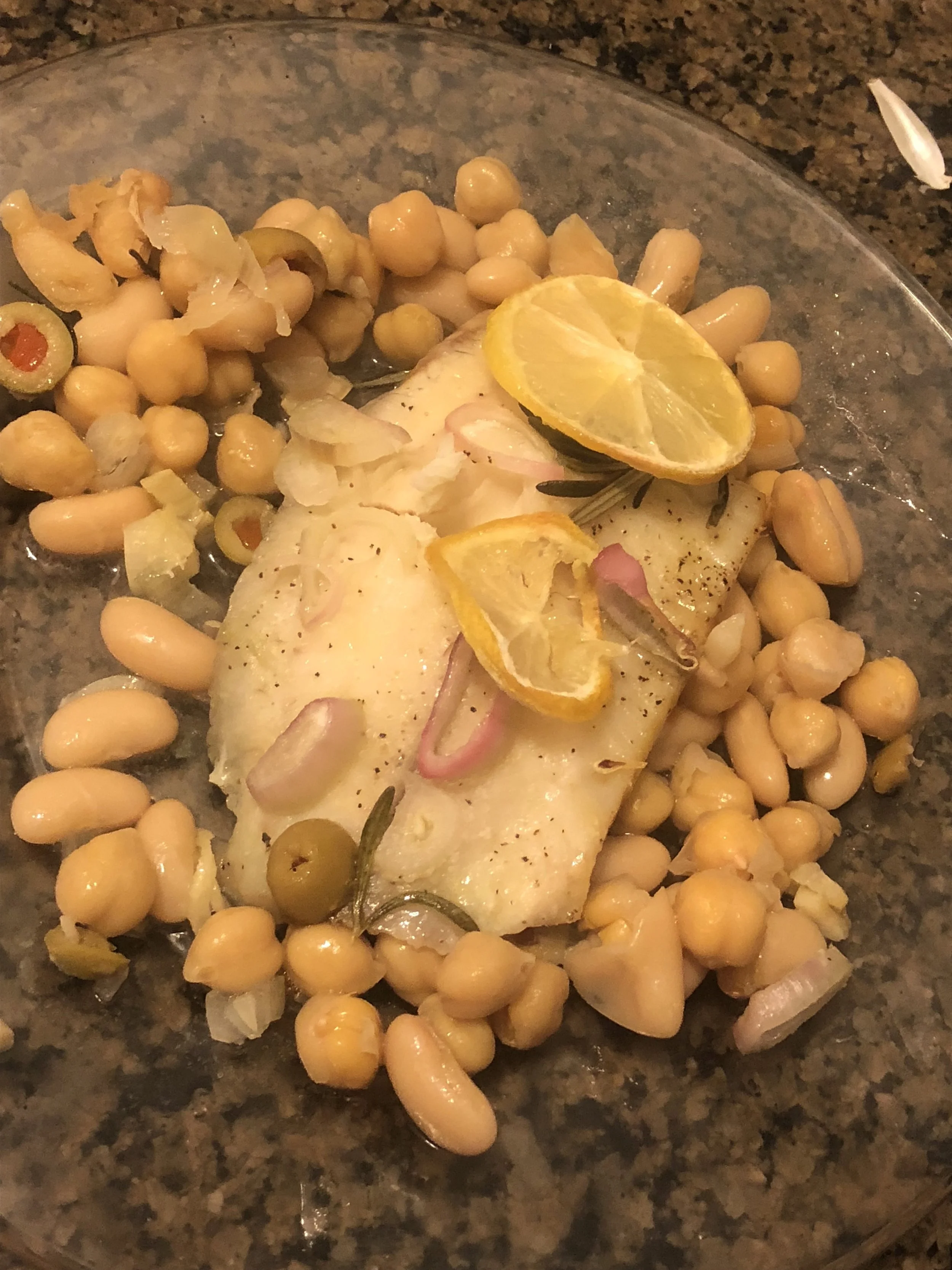 Ingredients2 whitefish fillets2 cans of white kidney (cannelloni beans)2 sprigs of rosemarymedium shallot3-5 clove sof garlic5-5 tbs of olive oilsalt and pepperpowdered garliccup of green olives