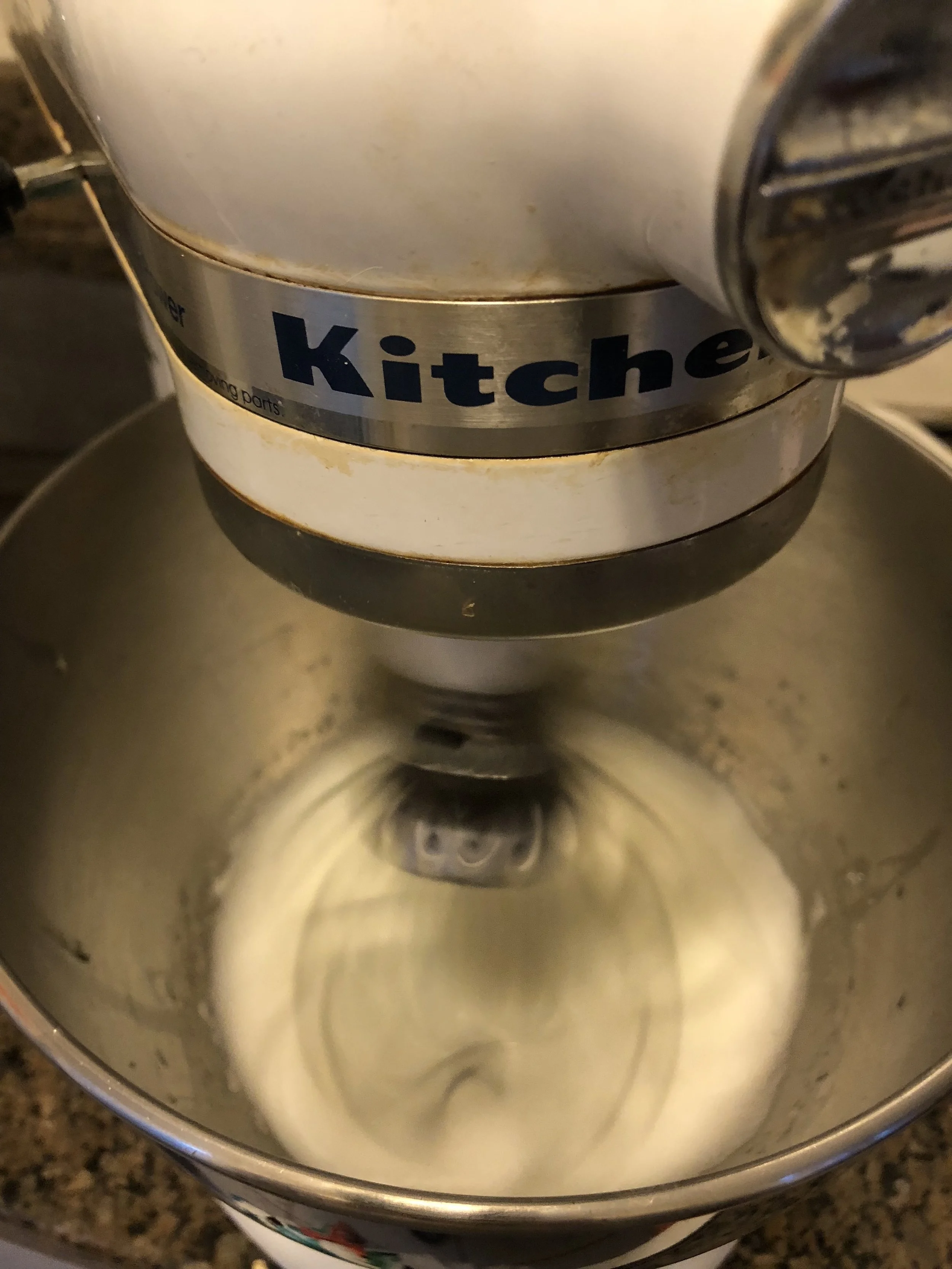 Add the egg white of 2 medium eggs and turn on your mixer on high and whip until medium peaks form.