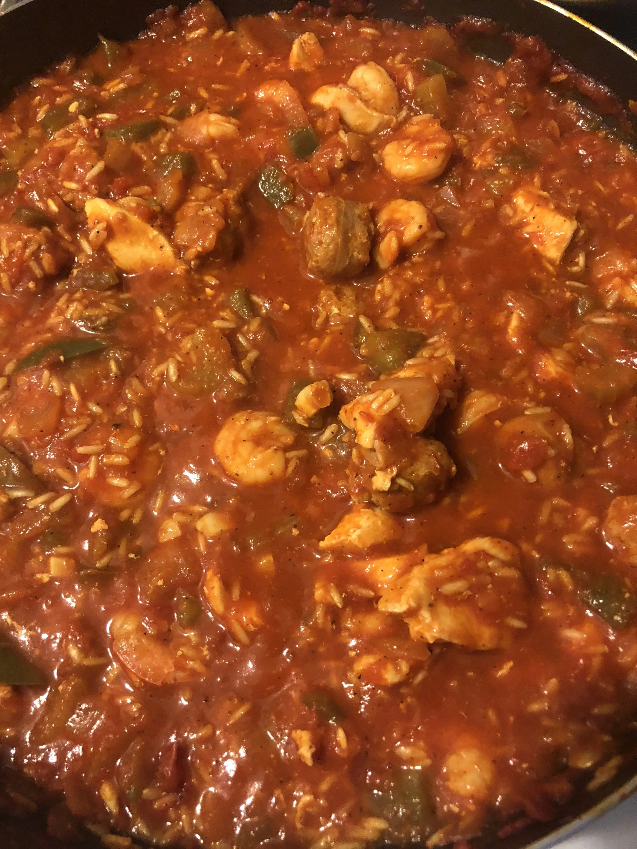 When the shrimp have cooked, under medium low heat, add the chicken and sausage to the mixture. Keep on low to integrate all the seasonings and add the rice when it is cooked. Stir and serve hot.My Comments: I have adjusted to accommodate my rice su…