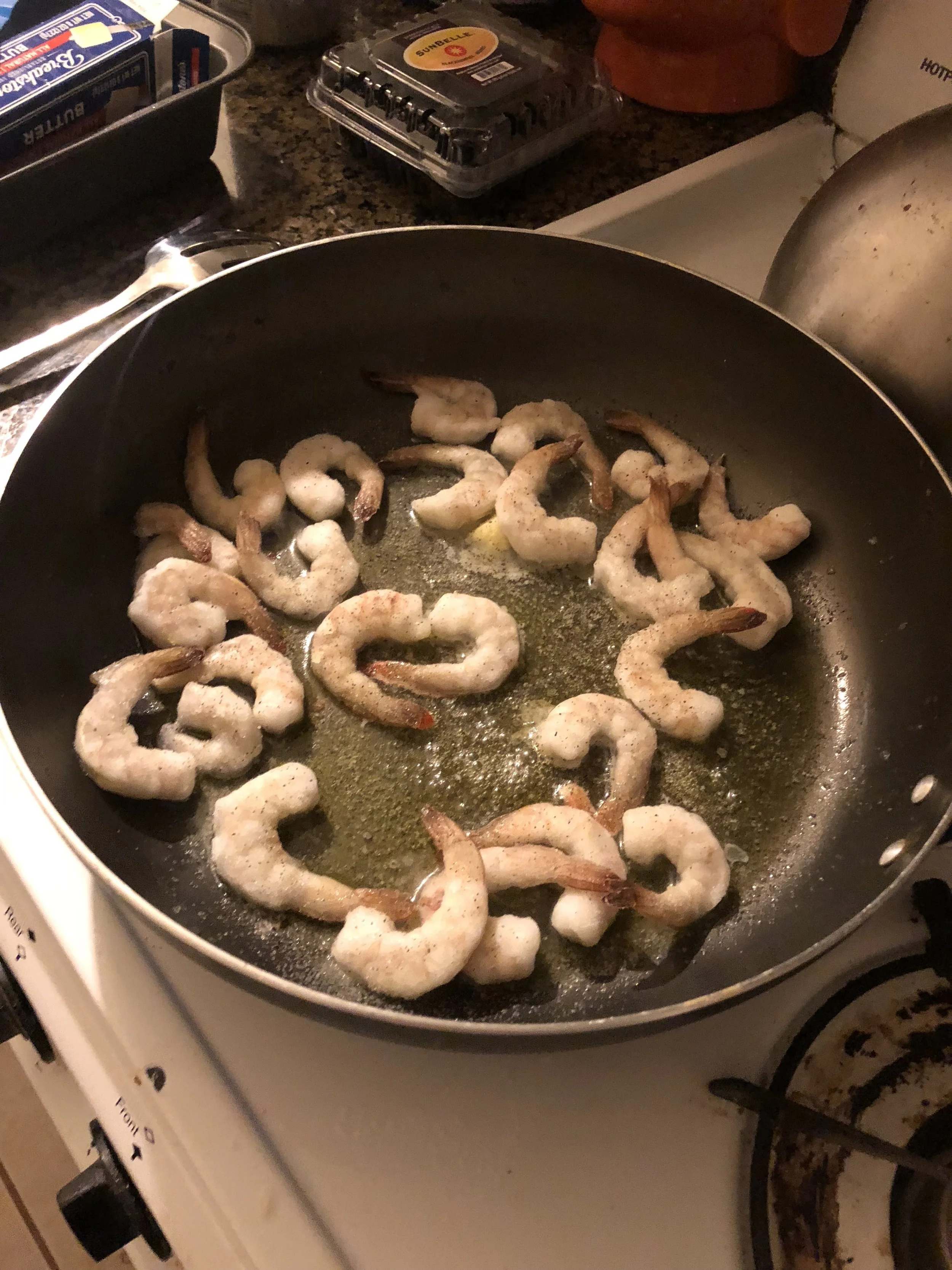 Add the butter and oil to your medium skillet and when hot add the diced garlic.  When garlic is aromatic, add the shrimp