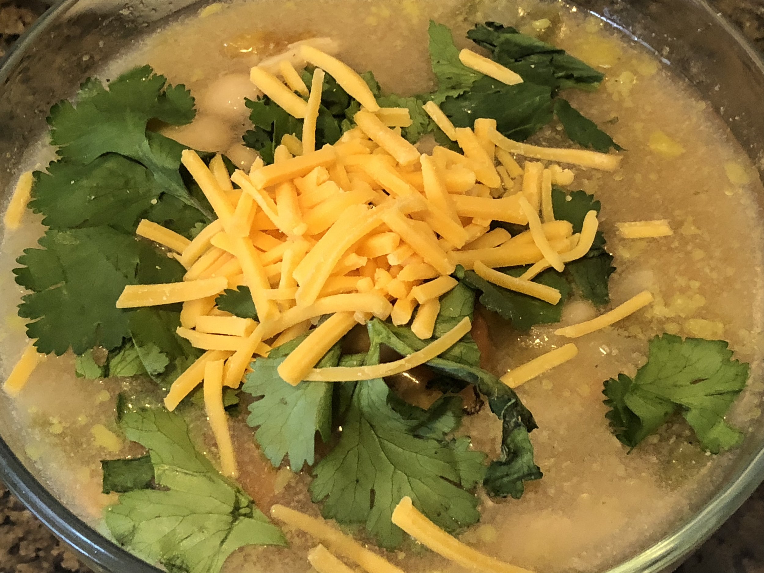 Ingredients2 cans of white beans, preferably cannellini2 lb of boneless and skinless chicken breastscan of diced roast green chilisMedium spanish onion (diced)can of corn (optional)tbls of cumin6 cups of chicken stock ( I made my own and added 3 pac…