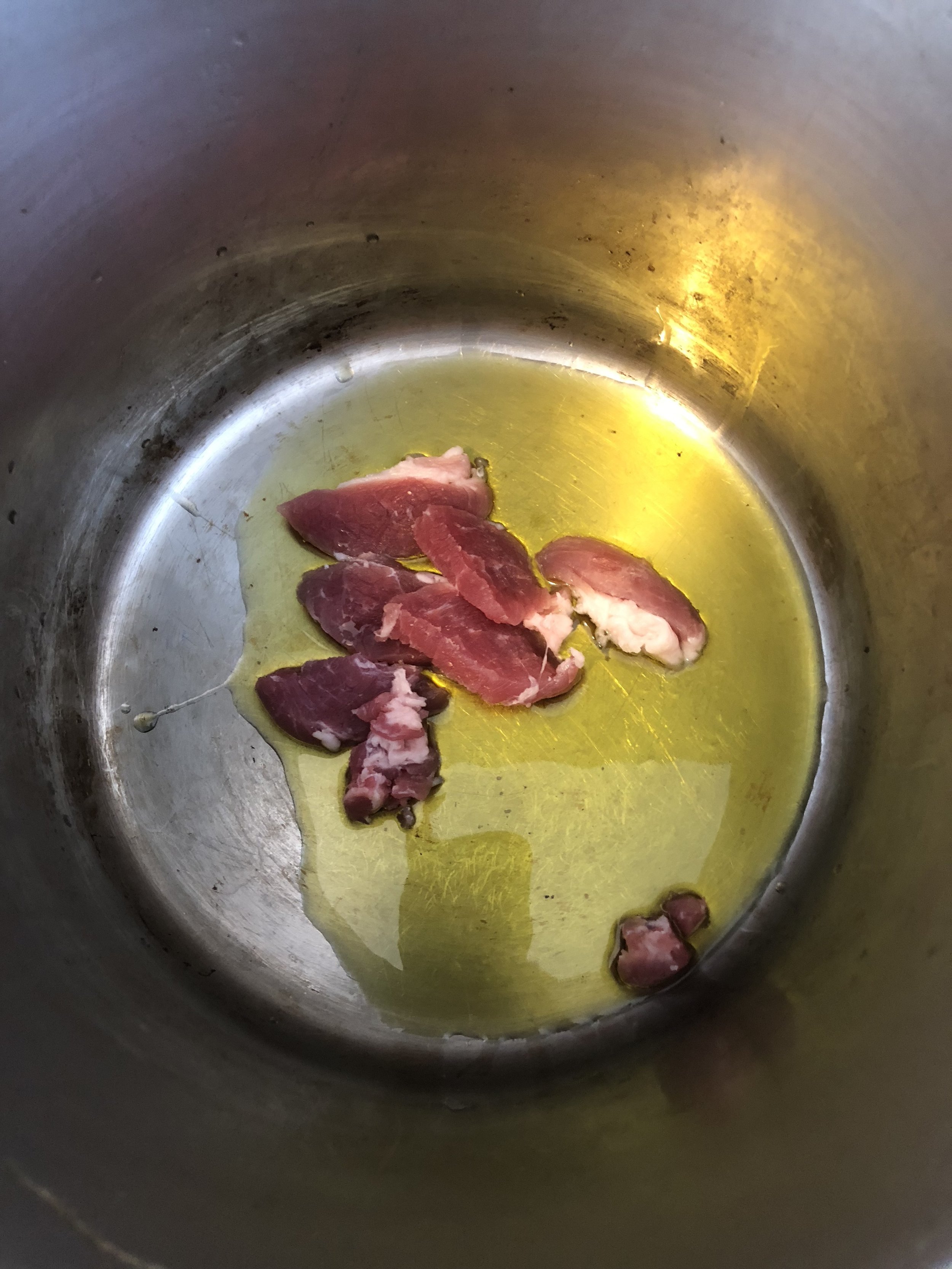 Add the olive oil and salt pork to your stockpot