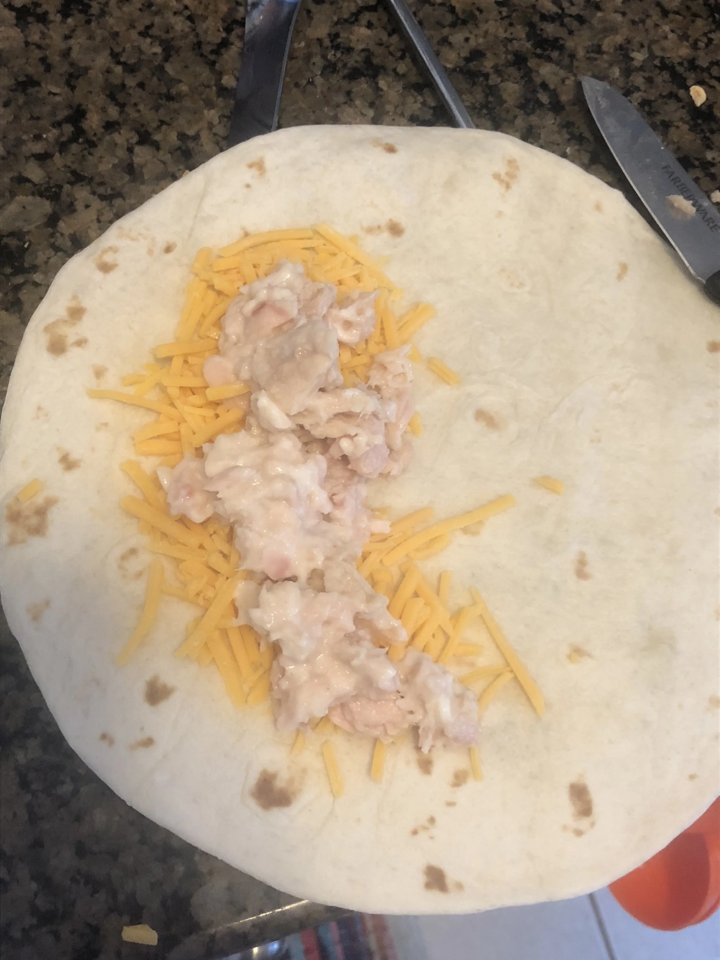 Prepare the tunafish by mixing tuna and may. Who I make tuna sandwiches I have my own concoction including shallots at times and B&G relish, but for this recipe I made it straight up deli style with tuna and mayonnaise. Place 2-3 spoonfuls of tuna on top of the cheese.