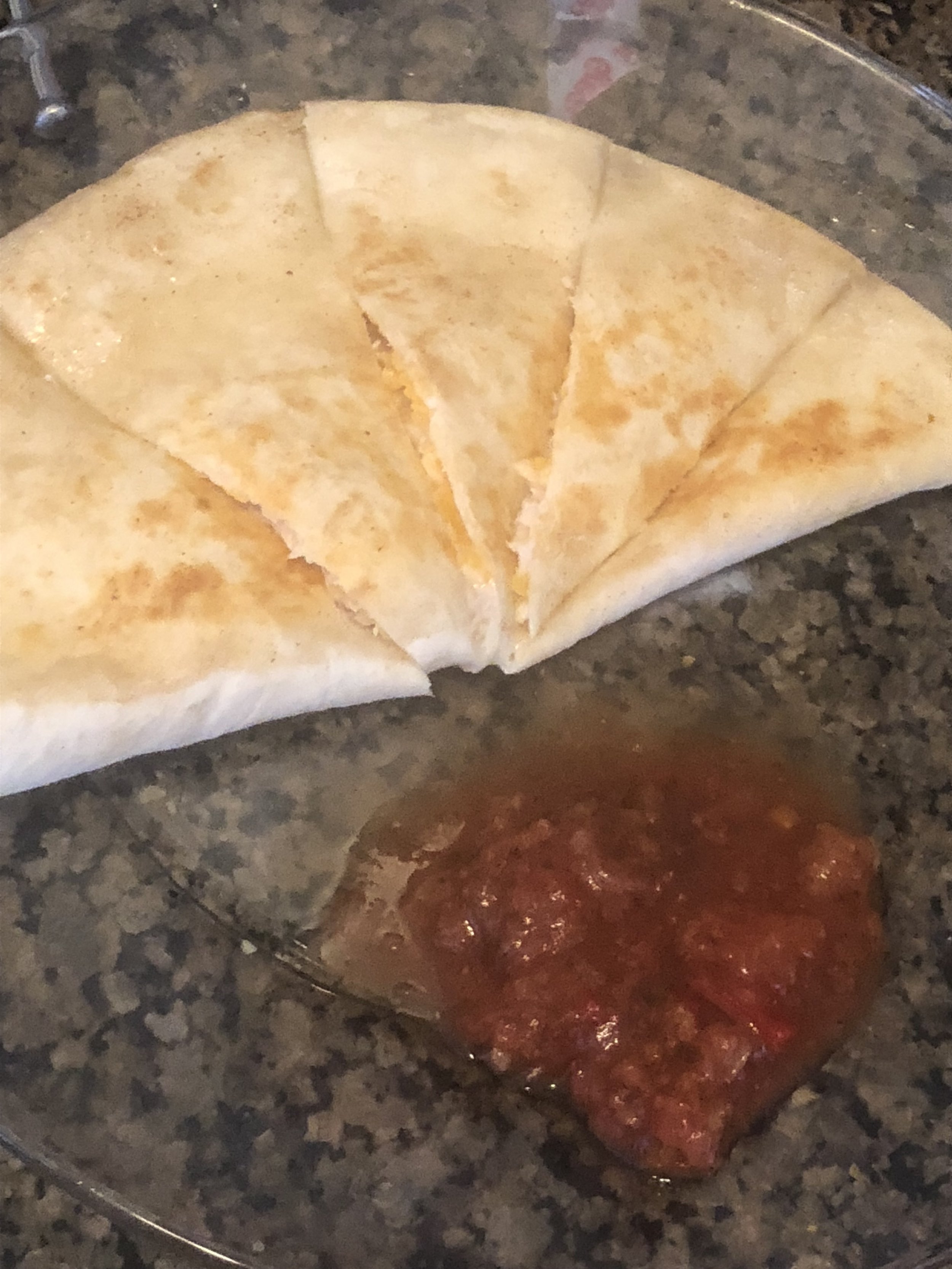 Cut into triangle pizza slice shaped slices and serve. Salsa is pictured, but often I drizzle with barbecue sauce, for some country twang. I might start singing songs like “I shaved my legs for this” if I use to much barbecue, so I am very controlle…