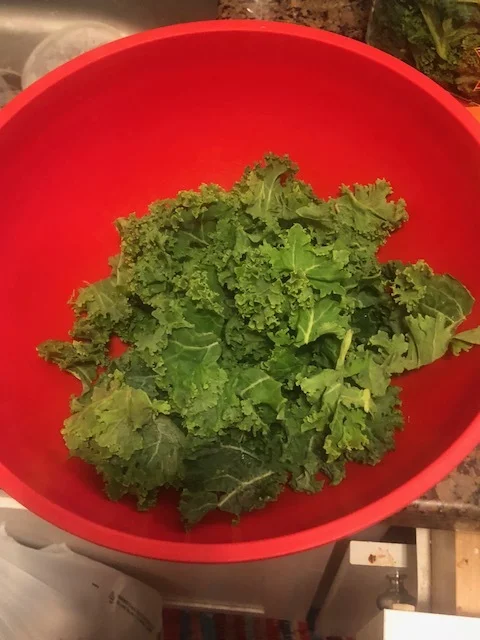 Clean 2 cups of kale into bite sized pieces and remove the stalks