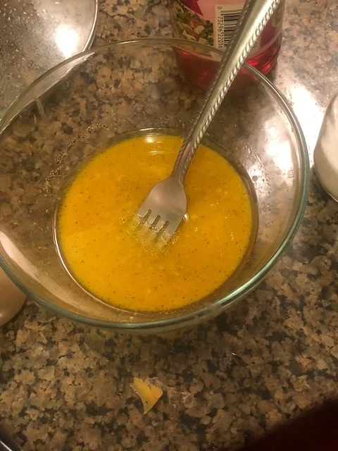 while the potatoes and sausage cook, mix the dressing for the kale. Add the honey, vinegar, olive oil, and spice and stir together until completely integrated