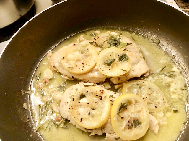 An lb of chicken medium lemons sliced thin 2-3 sprigs of rosemary 2 sprigs of sage 5-6 cloves of garlic salt and pepper medium sized pat of butter