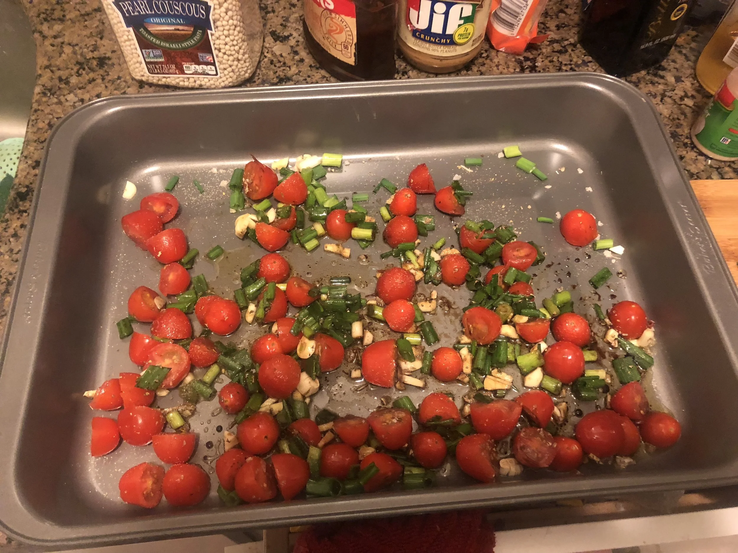 Evenly put the mixture on your rimmed baking dish and put into the oven at 390. I put it in the oven at 450, it started smoking because of the smoking temperature of olive oil.