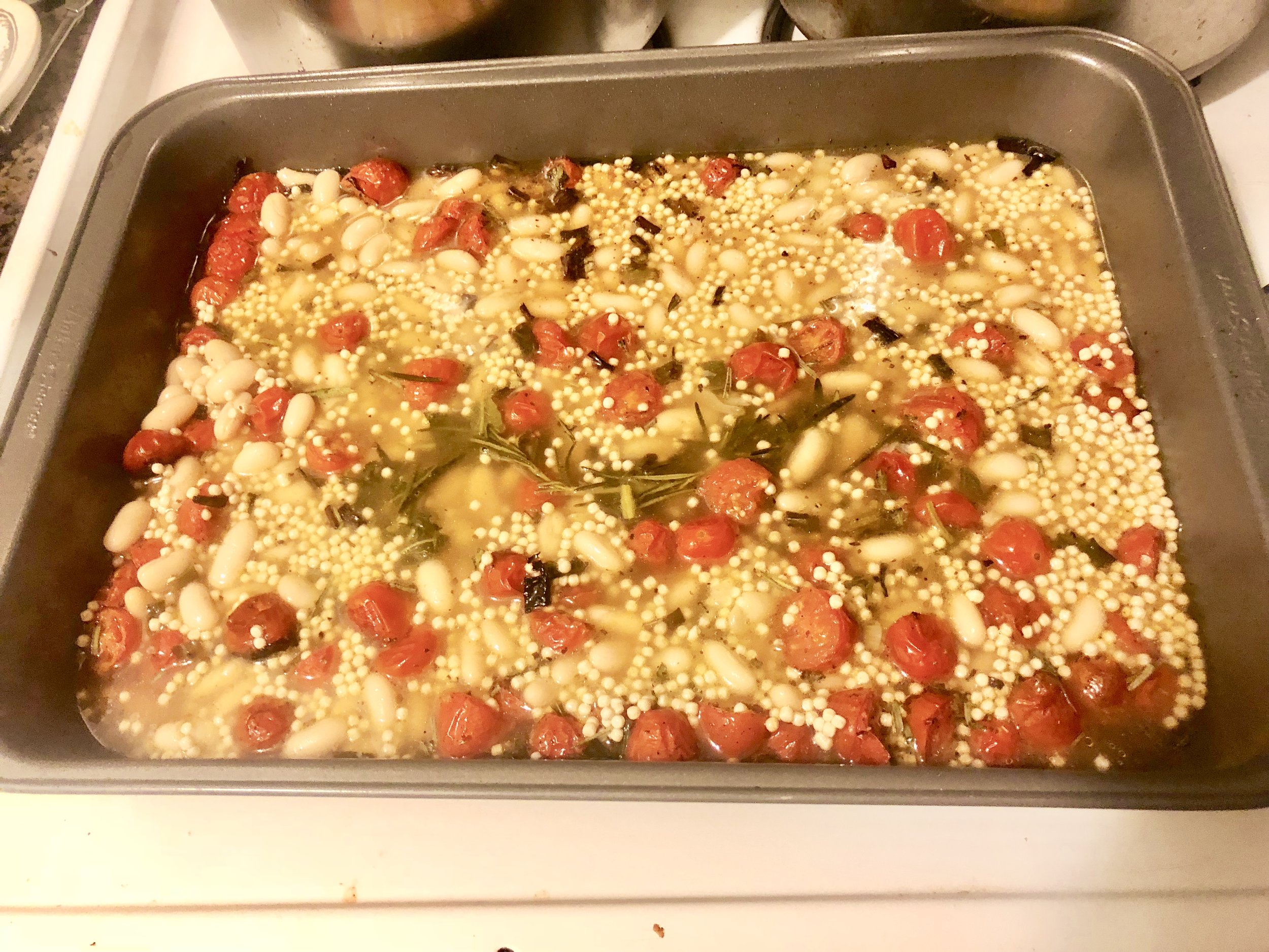 Open the cannelloni beans and put into the pan with the tomatoes. Pour the stock into your baking dish, add the couscous and place into the oven. Cook for 25-30 minutes. Remove from the oven when couScous is cooked through and covered with sprinkled…